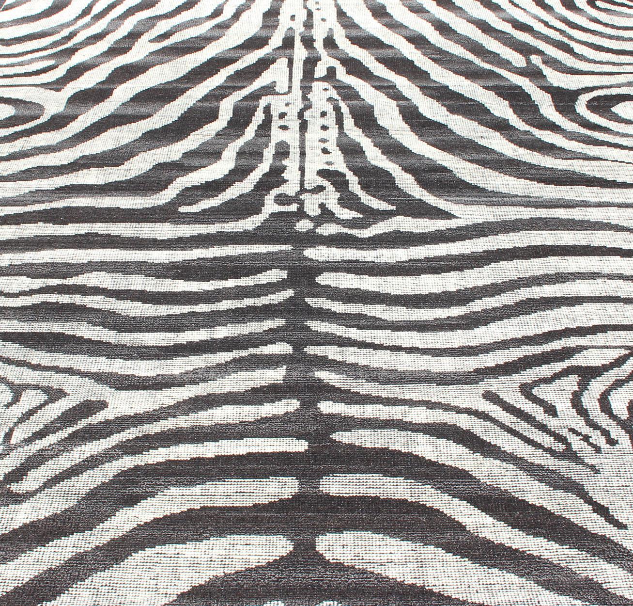 Ivory black and charcoal modern zebra design distressed piled rug, rug KHN-1023-TR-1048, country of origin / type: India / Modern piled rug.

A unique take on a zebra design, this dynamic and exciting composition is beautifully suited for both