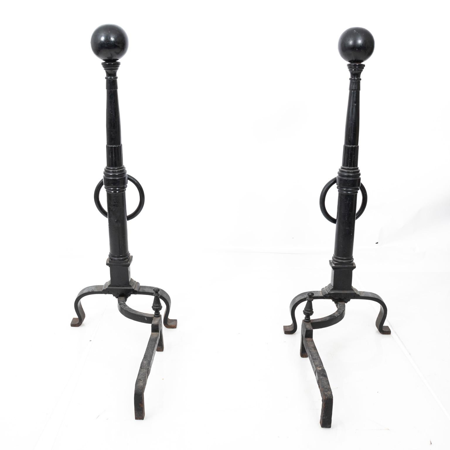 Black wrought iron ball finial andirons. Please note of wear consistent with age and daily use.
  