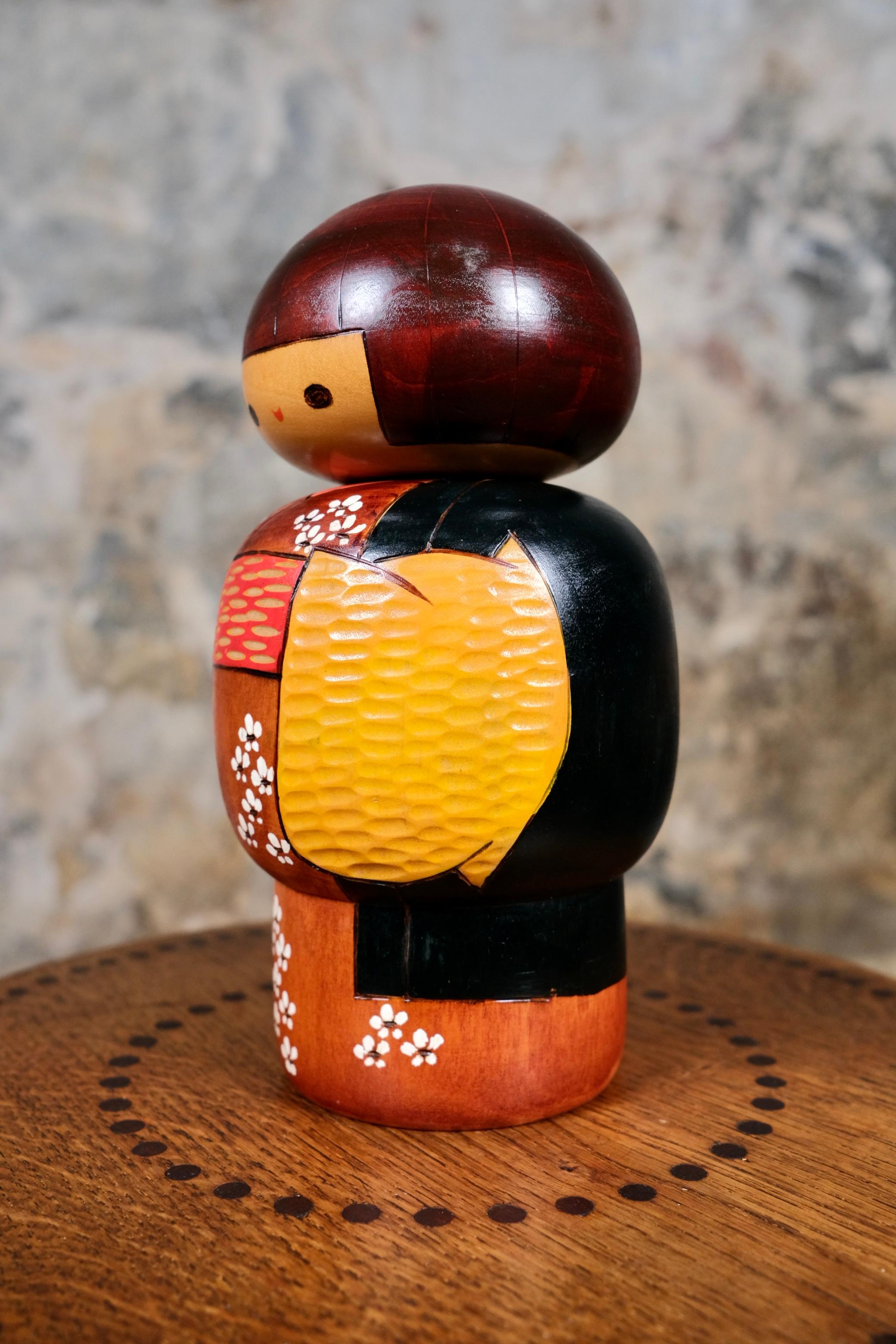 Folk Art Black and yellow kimono kokeshi by Bitoku, 1970s, Japan For Sale
