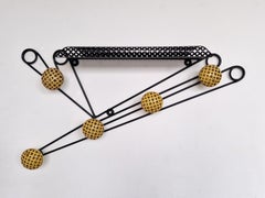 Black and yellow wall coat rack in the style of Matégot and Feraud, France 50s