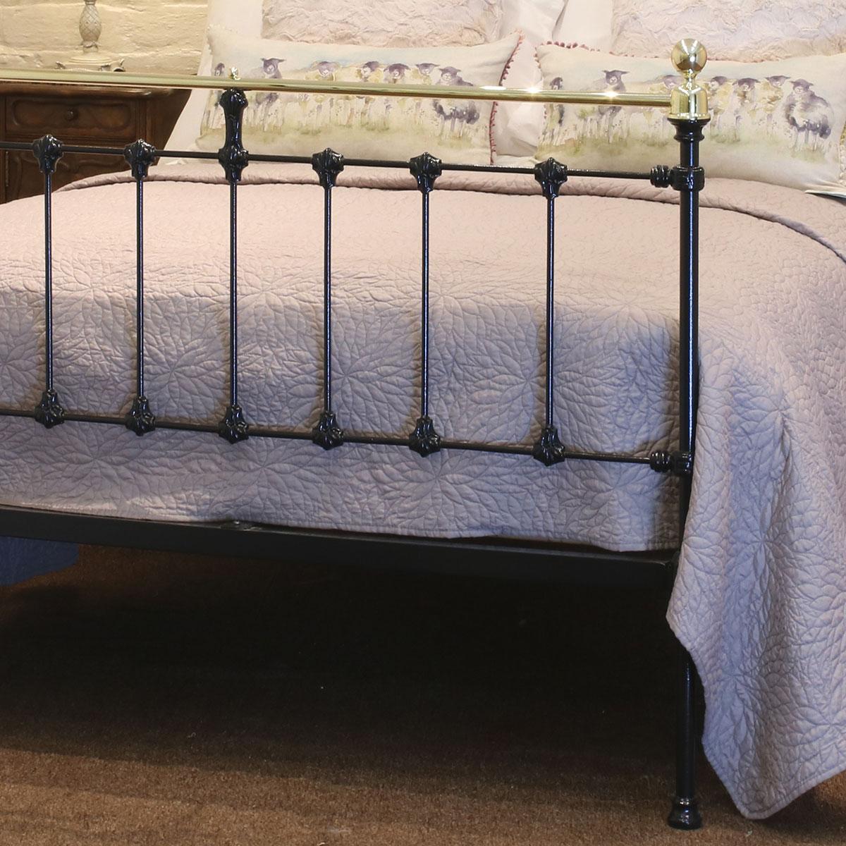 Double Victorian antique bed finished in black with straight top brass rails.

This bed accepts a 4ft 6in wide (54 inch or 135cm) base and mattress.

The price includes a standard firm bed base to support the mattress. 

The mattress bedding and bed