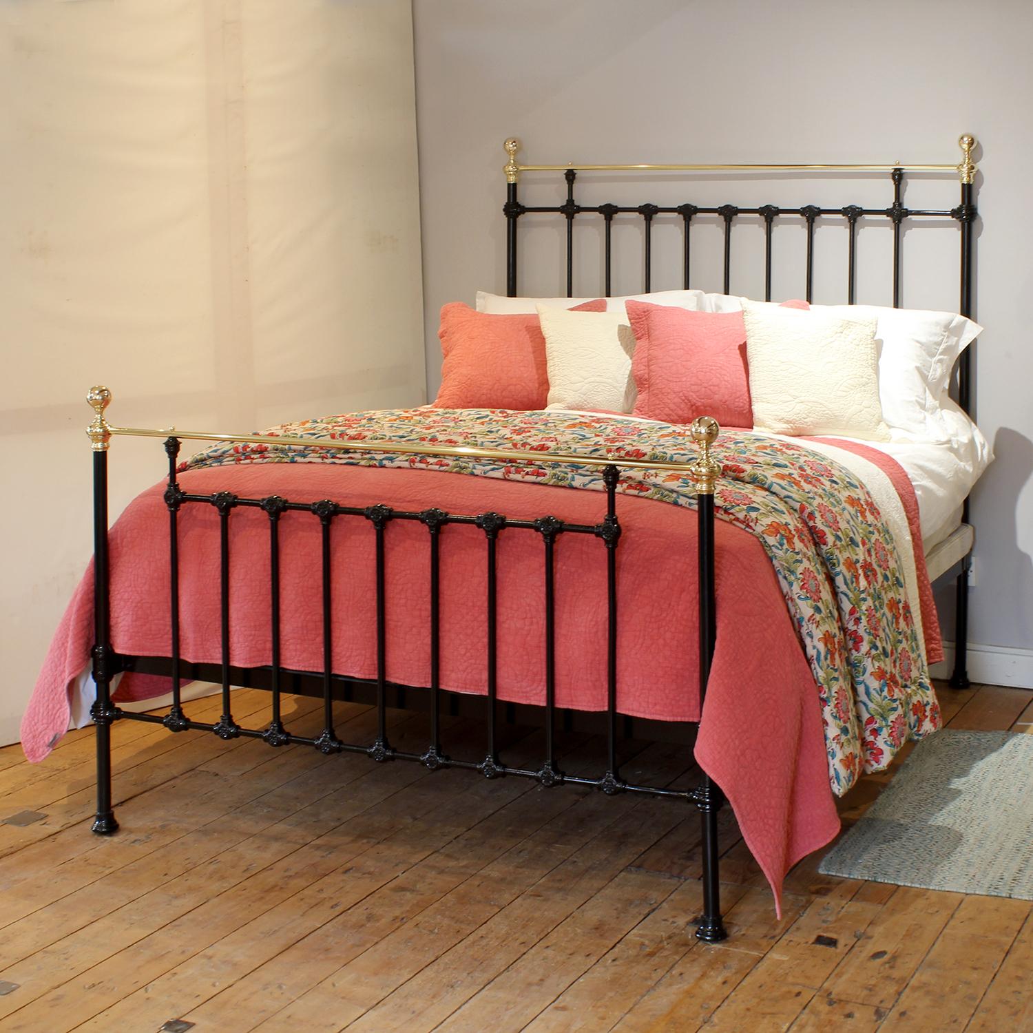 An attractive cast iron antique bed finished in black with straight brass top rails and decorative castings.

This bed accepts a UK king size or US queen size (5ft, 60in or 150cm wide) base and mattress set.

The price includes a standard firm bed