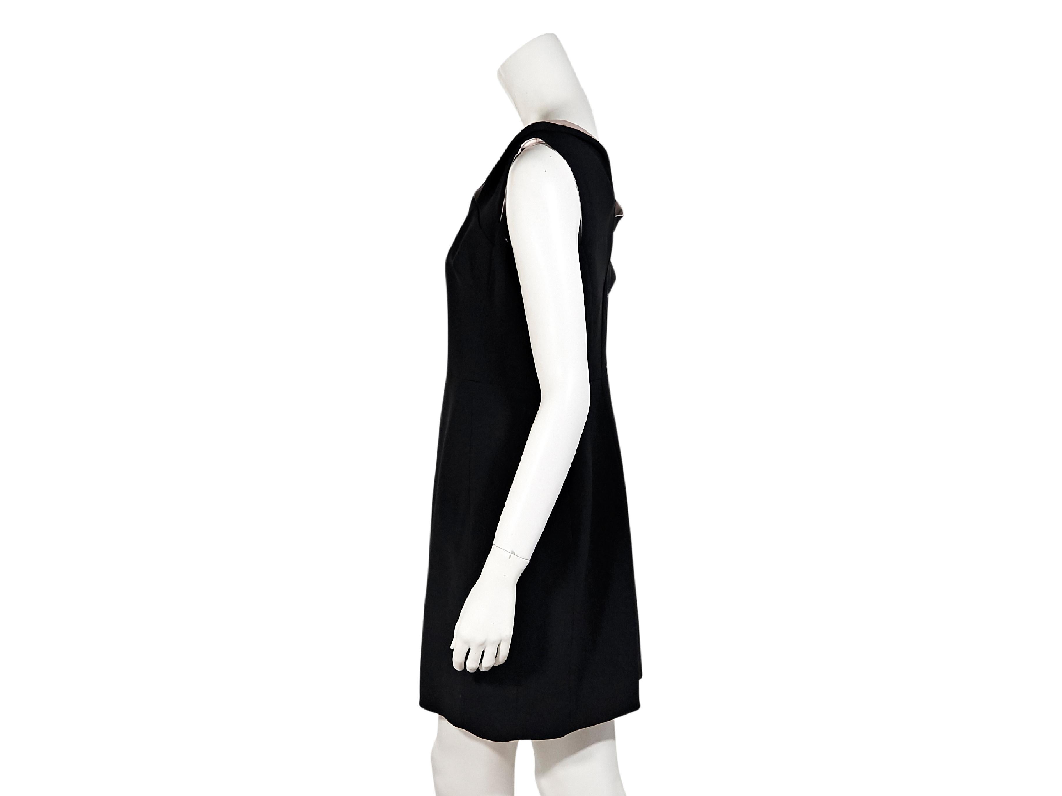 Product details:  Black asymmetrical sheath dress by Antonio Berardi.  Asymmetrical neckline and sleeves.  Exposed back zip closure.  28