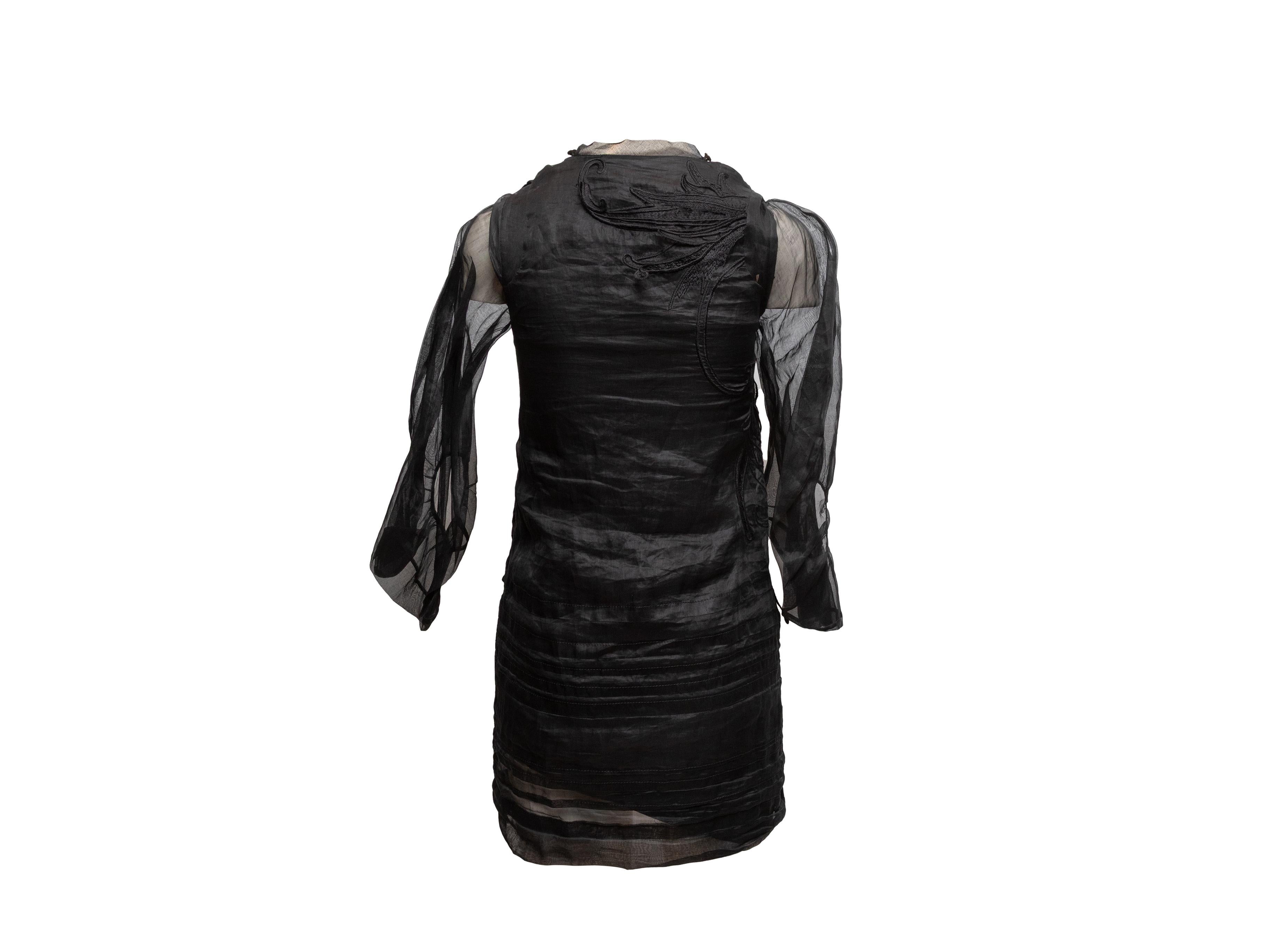Black cotton embroidered long sleeve mini dress by Antonio Berardi. Crew neck. 32