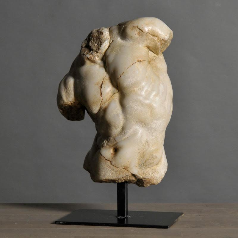 Black Apollo torso sculpture, small size, in resin and metal base.

Apollo is the male emblem of strength and beauty. This small Greek torso is the perfect embodiment of the son of Zeus and Leto. From the 5th century BC, the Romans also adopted him
