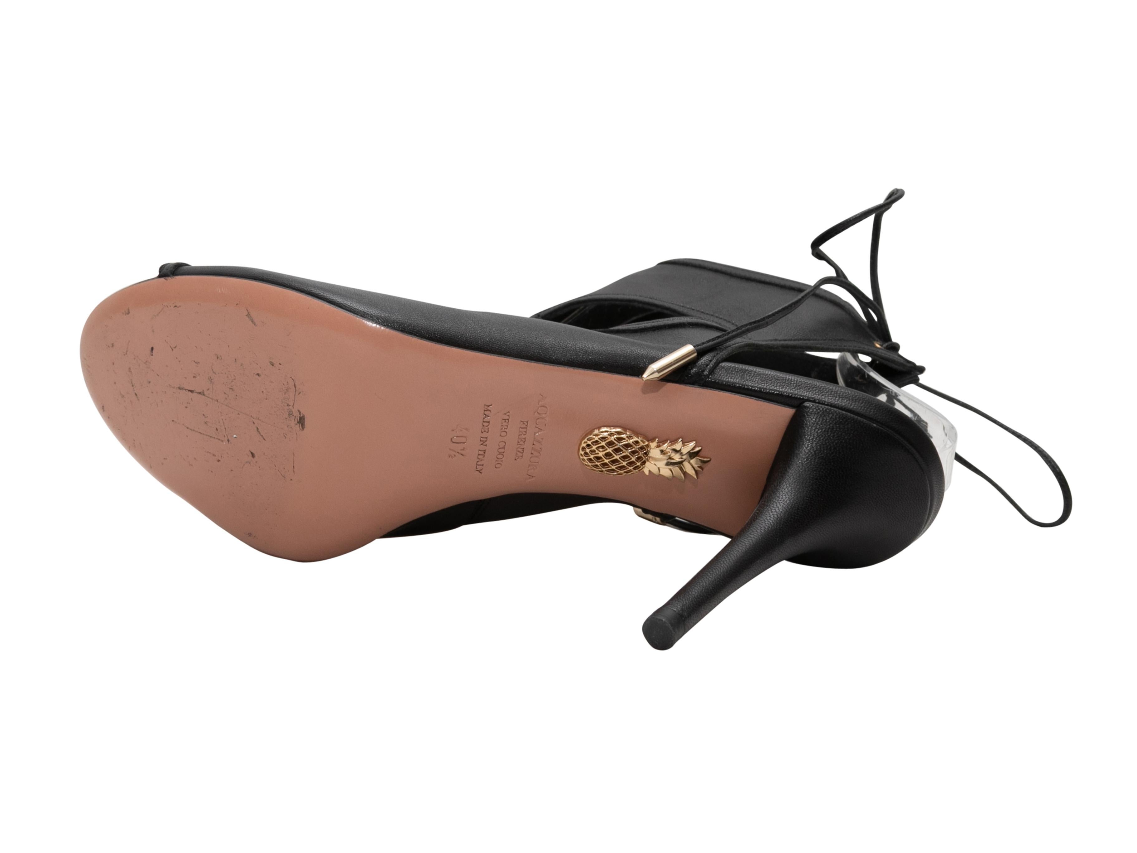 Black leather cutout peep-toe heeled booties by Aquazzura. Lace-up tie closures at ankles. 4