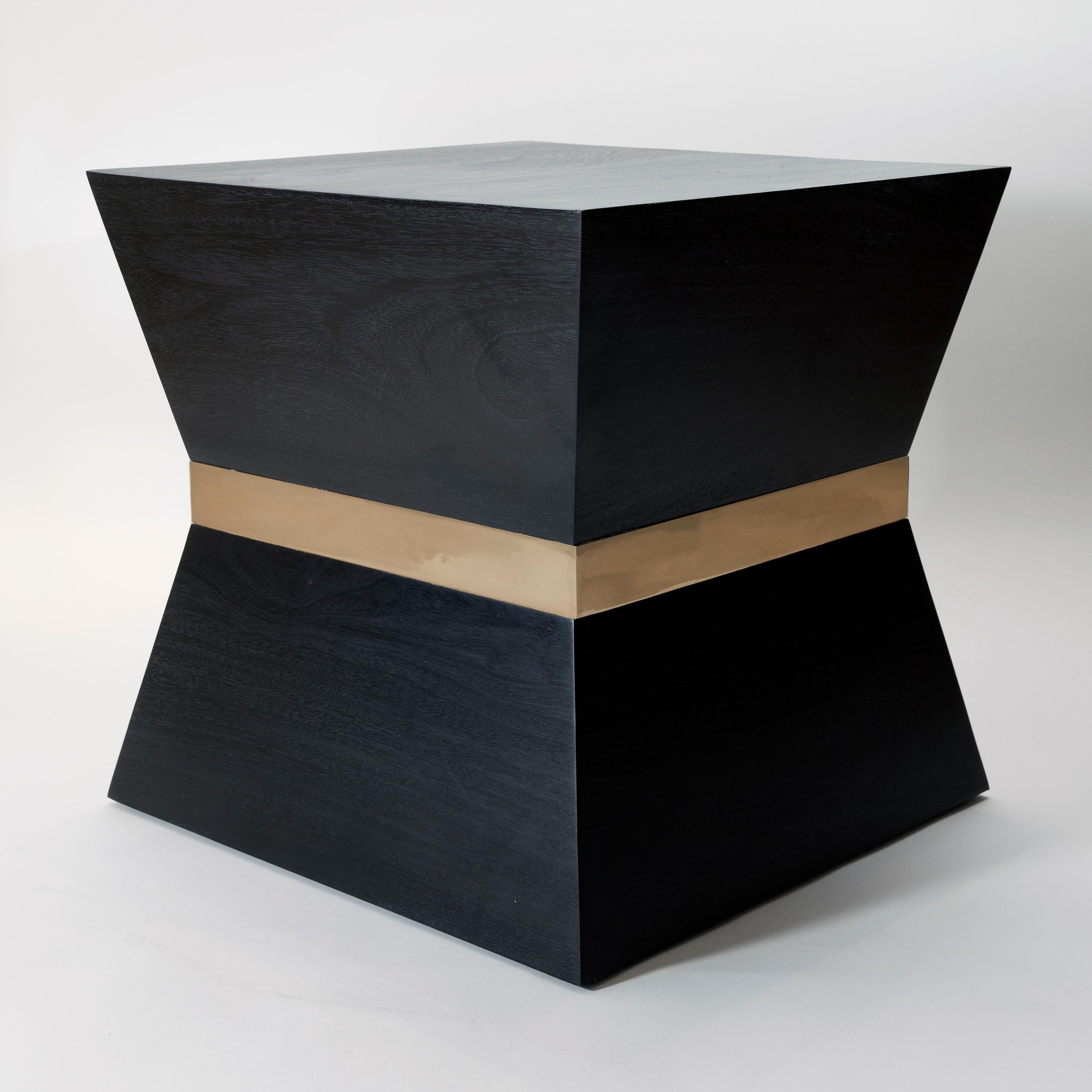 Black (RAL 9004) satin lacquer tapered ash side table with brass trim. Also available in white (RAL 9001) satin lacquer ash with black (RAL 9004) trim.

Measures: W 50 x D 50 x H 50 cm.

Currently in stock, 10 - 14 weeks lead time for large