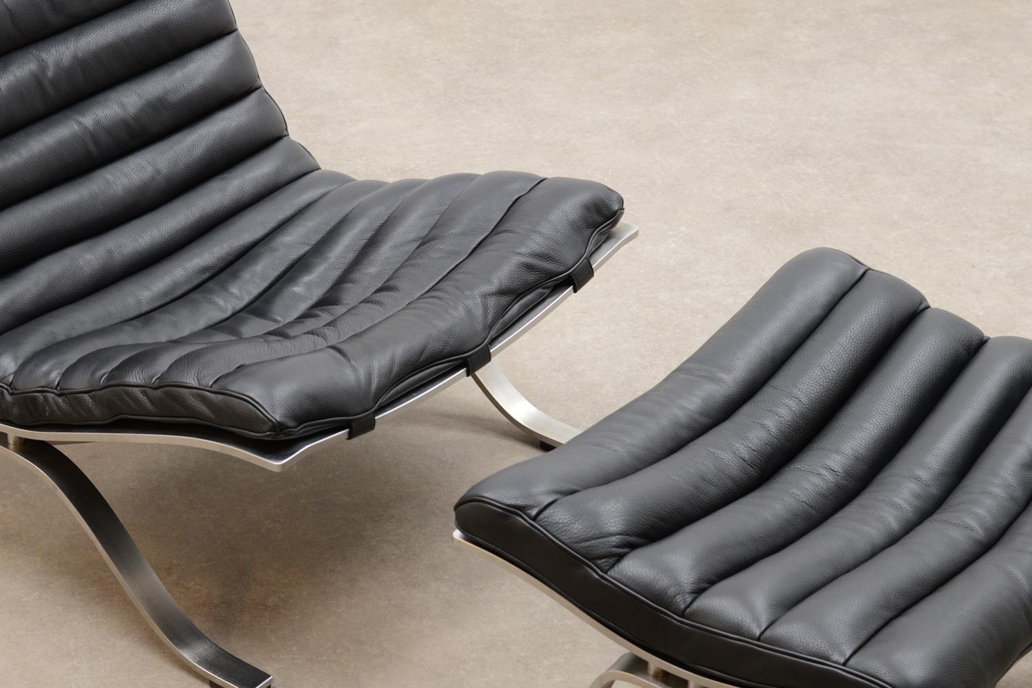 Mid-Century Modern Black “Ari” Chair and Ottoman by Arne Norell for Norell Möbel AB