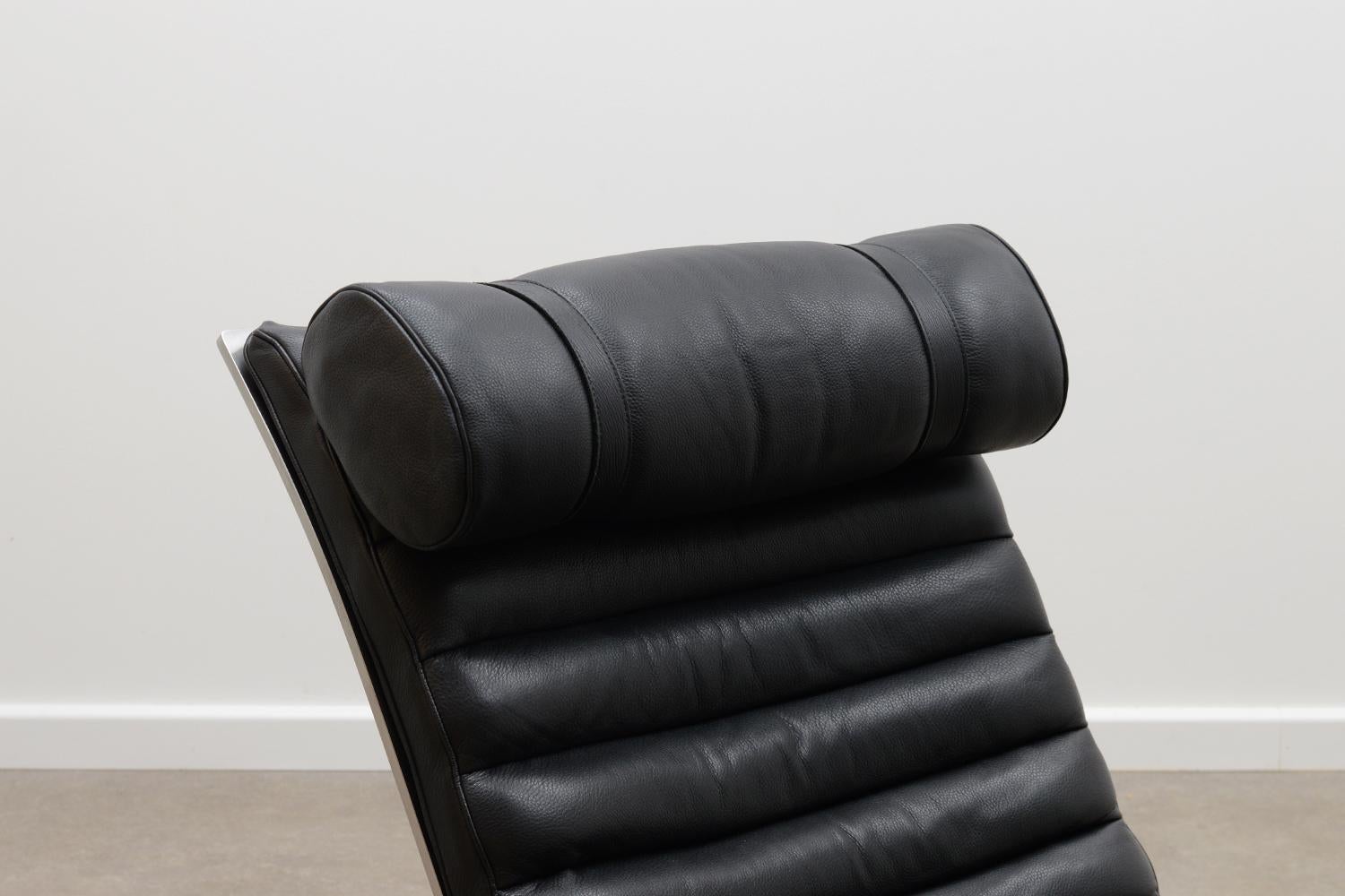 Swedish Black “Ari” Chair and Ottoman by Arne Norell for Norell Möbel AB