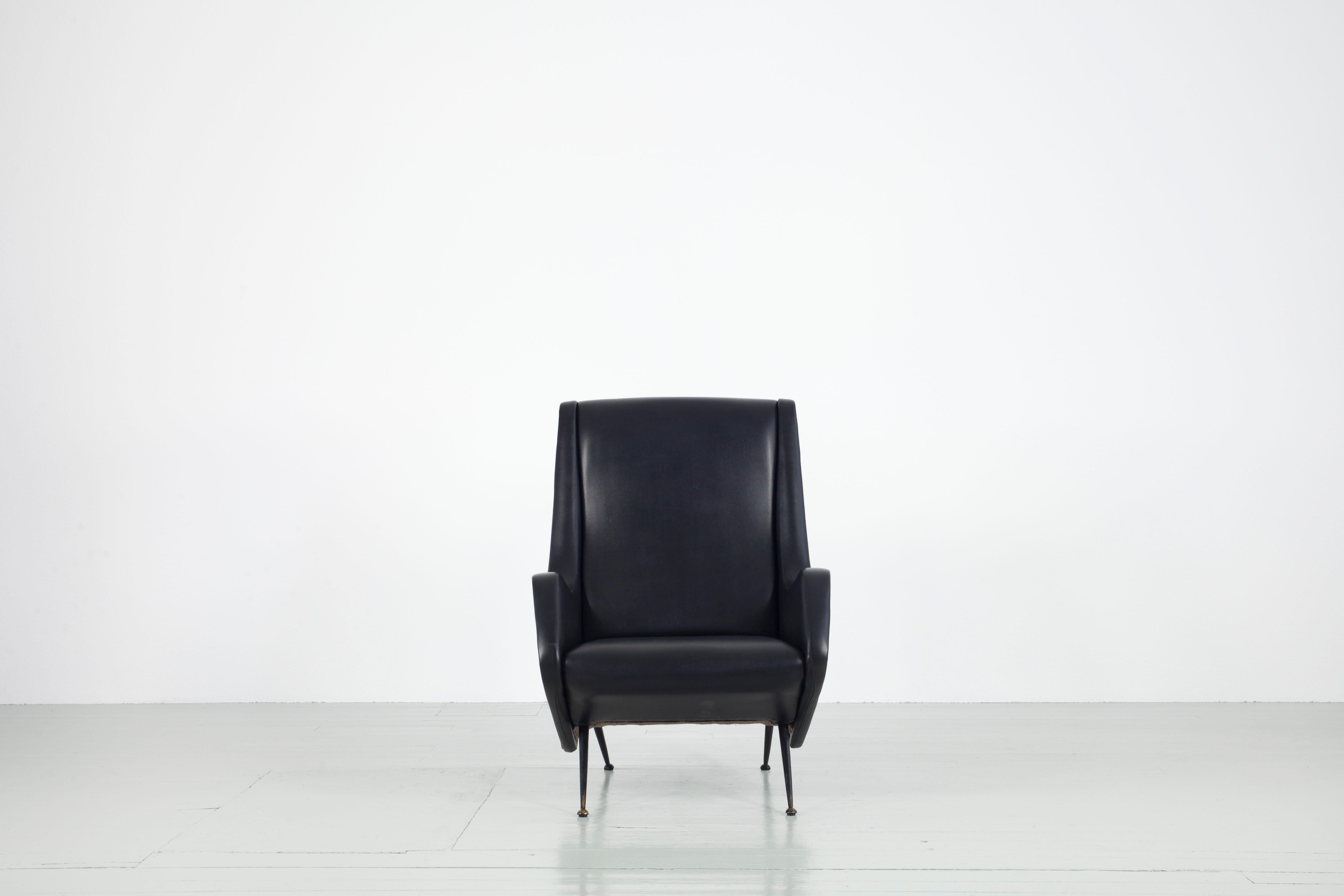 Armchair designed by Aldo Morbelli, manufactured by ISA Bergamo, Italy, 1950s. The piece is in perfect original vintage condition and has black vinyl leather covering.

