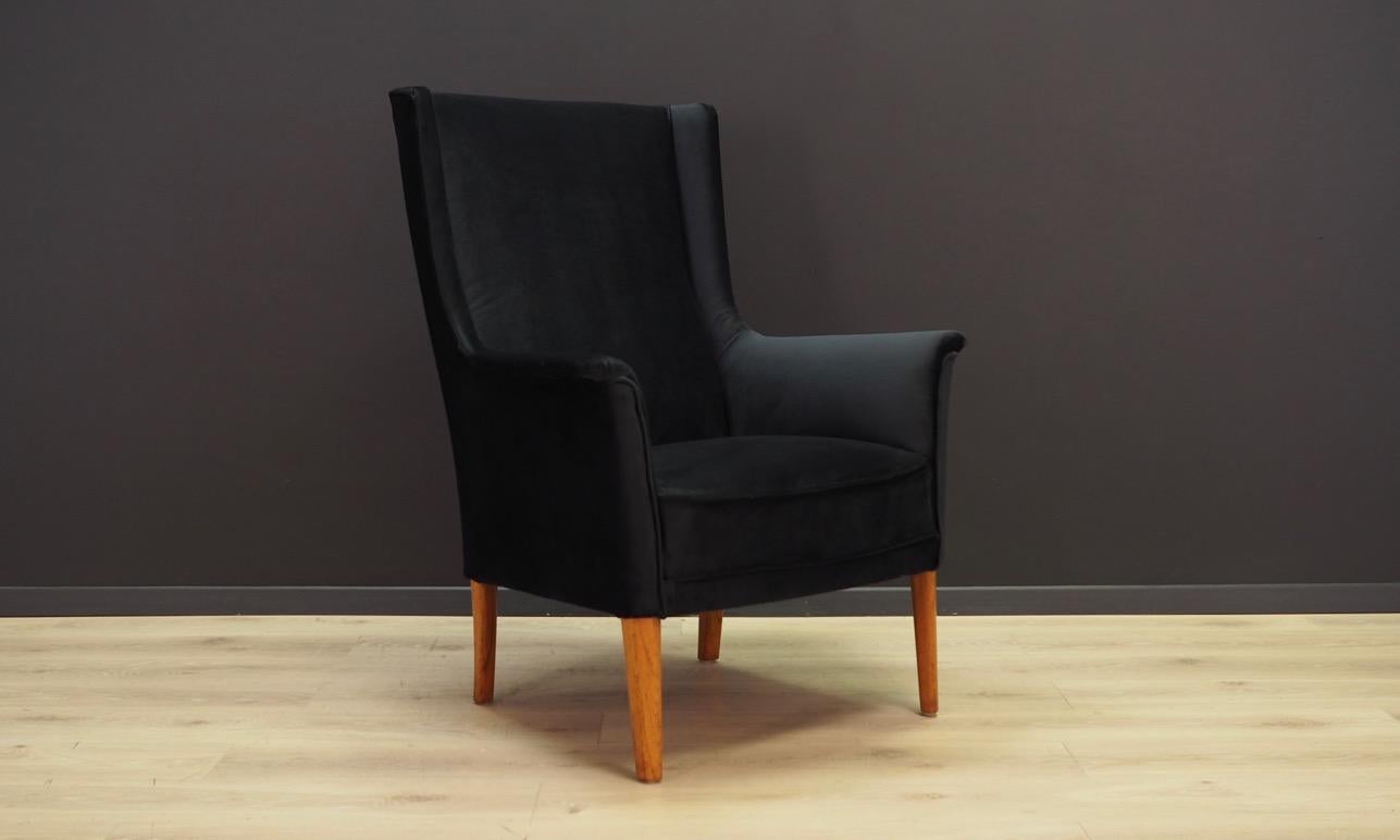 Phenomenal armchair from the 1960-1970s. Scandinavian design, Minimalist form. New upholstery made of velour in black colour. Legs made of solid teak wood. Maintained in good condition (minor bruises and scratches on the legs) - directly for