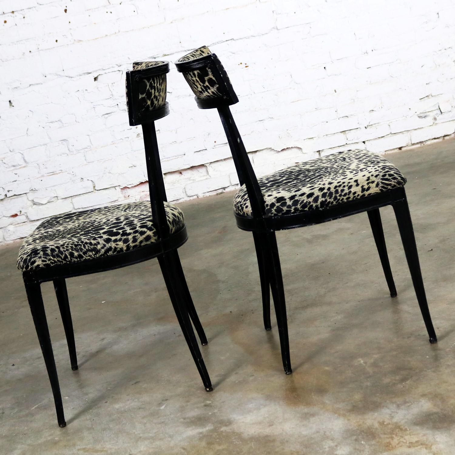 Awesome pair of Art Deco, maybe Hollywood Regency, side chairs by Crucible Products Corp. and attributed to David Weinstock. Black paint over cast aluminium and newly upholstered in a handsome black and beige animal print fabric. They are in