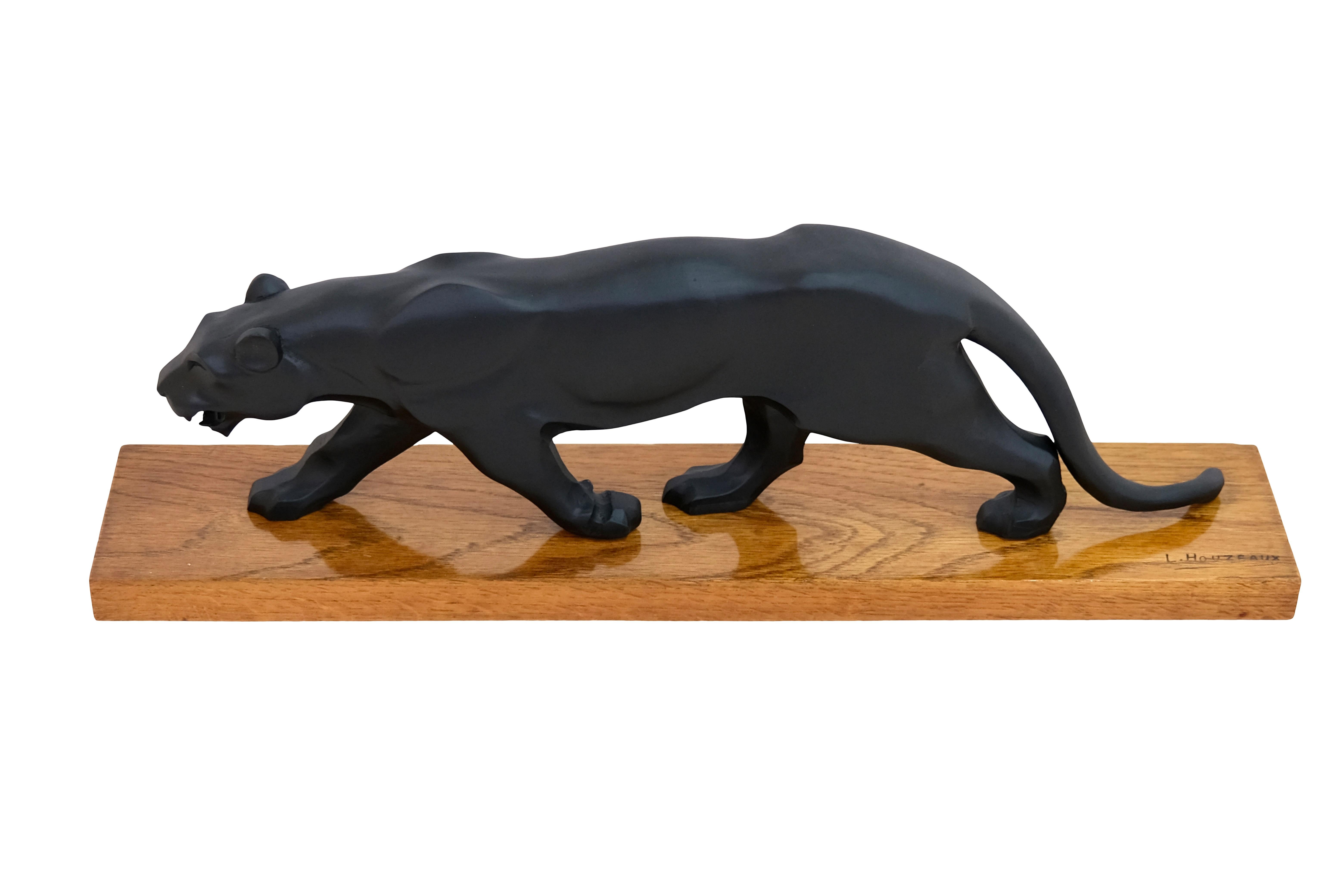 Black panther on oak base
signed L. Houzeaux

Original Art Deco, France 1930s

width: 65 cm
Height: 20 cm
Depth: 12,5 cm