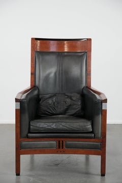 Black Art Deco cowhide leather and wooden design armchair with a high back