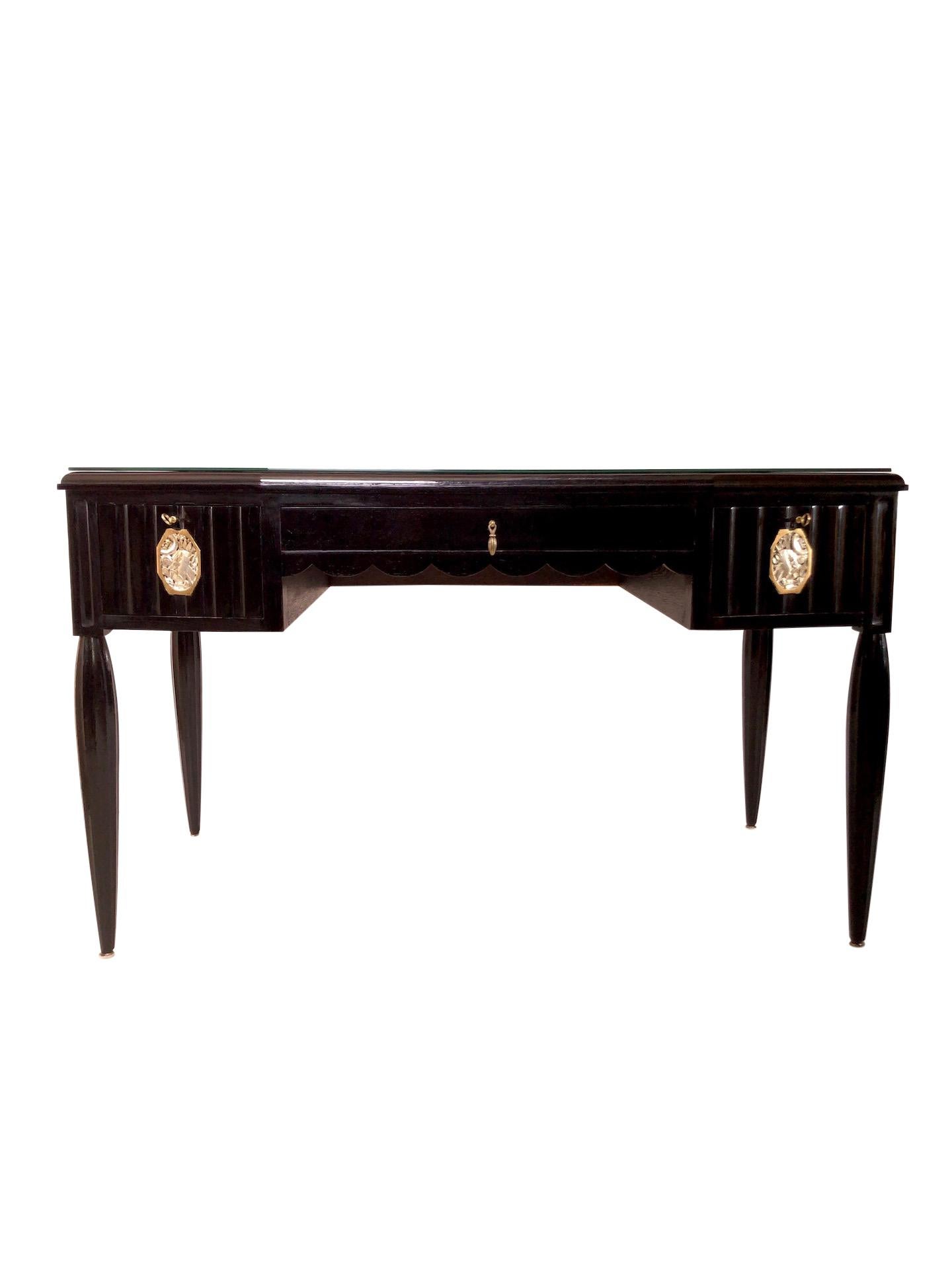 Very detailed desk with typical silver and golden Art Deco pattern.
Shellac hand polish.
The little desk has three drawers.
The two drawers on the sides are with key lock and the middle drawer has a typical fitting.
Channeled front and