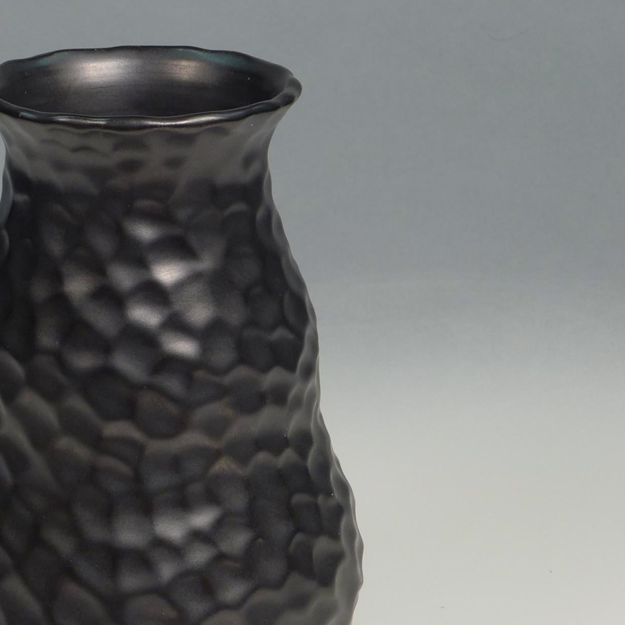 Elegant dimple vase designed by Gerardus Klinkenberg and produced at the Katwijk factory in the Netherlands, circa 1920s
Materials: Ceramic stoneware with a smooth black matt glaze.