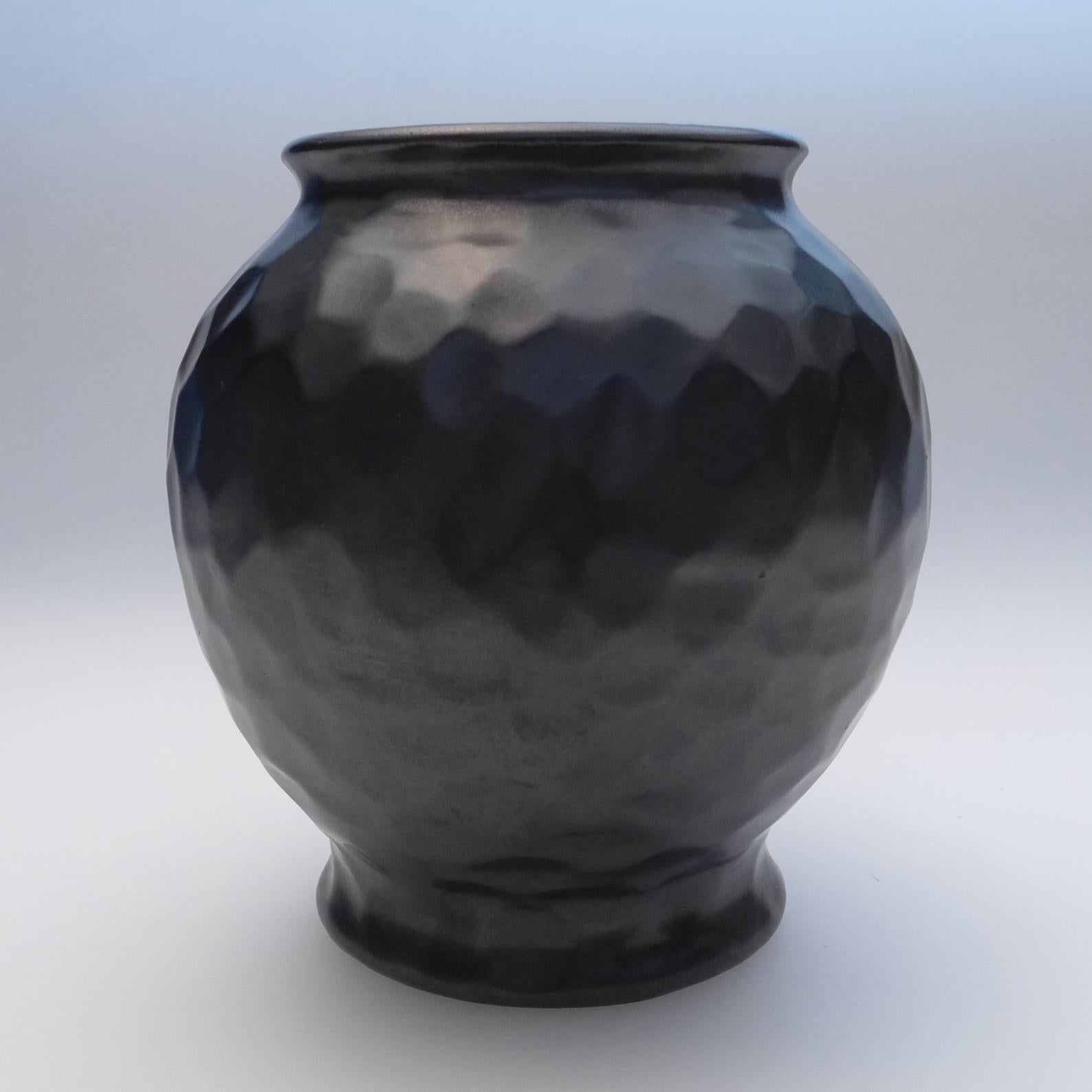 Elegant dimple vase designed by Gerardus Klinkenberg and produced at the Katwijk factory in the Netherlands, circa 1920s
Materials: Ceramic stoneware with a smooth black matte glaze.