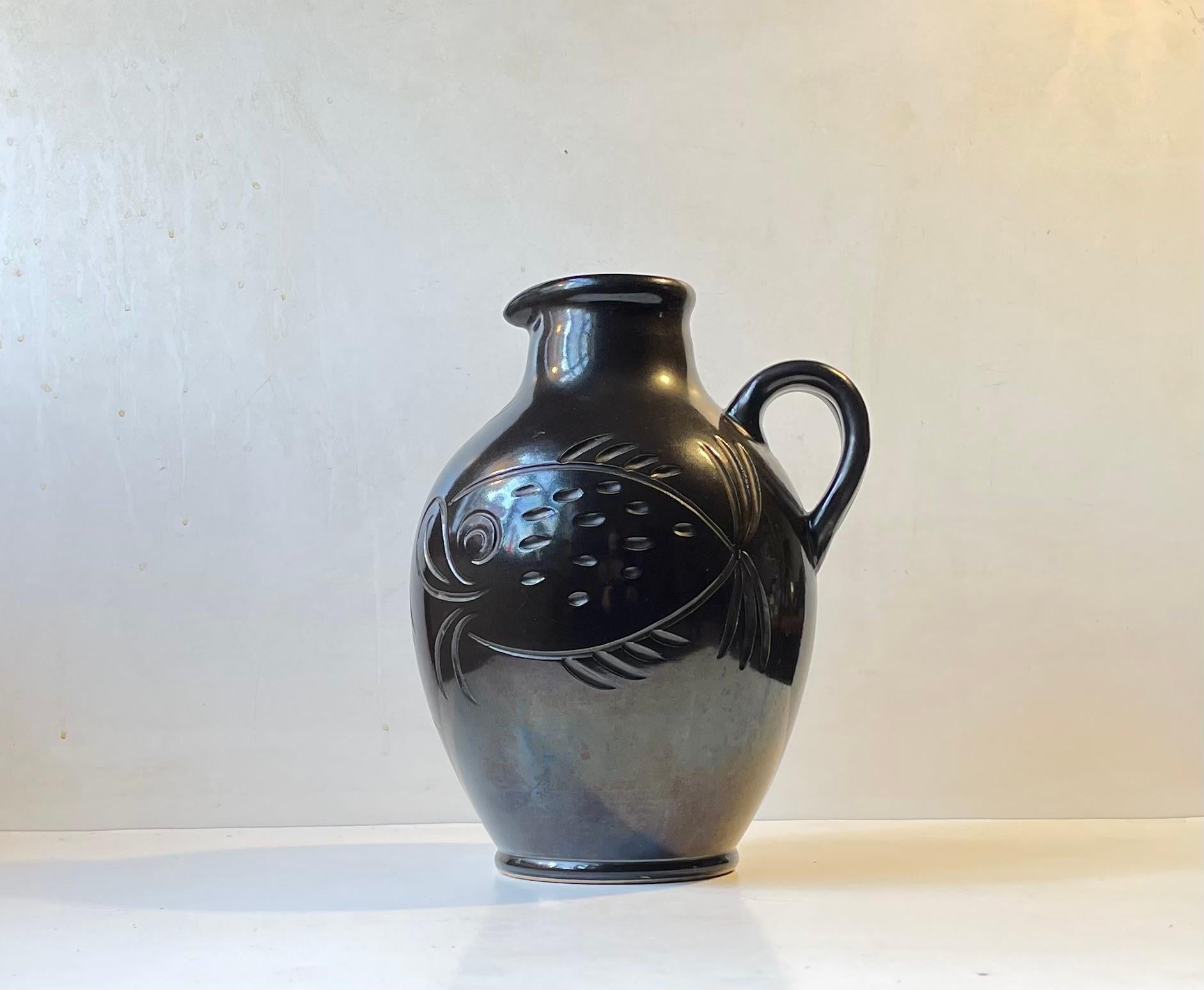 A very rare monumental jug-vase in black glaze with stylized incised fish motif. Numbered, signed and stamped with the monogram of MA&S to the bottom. Beautiful intact and clean vintage condition. Measurements: H: 29 cm, D: 20 cm.