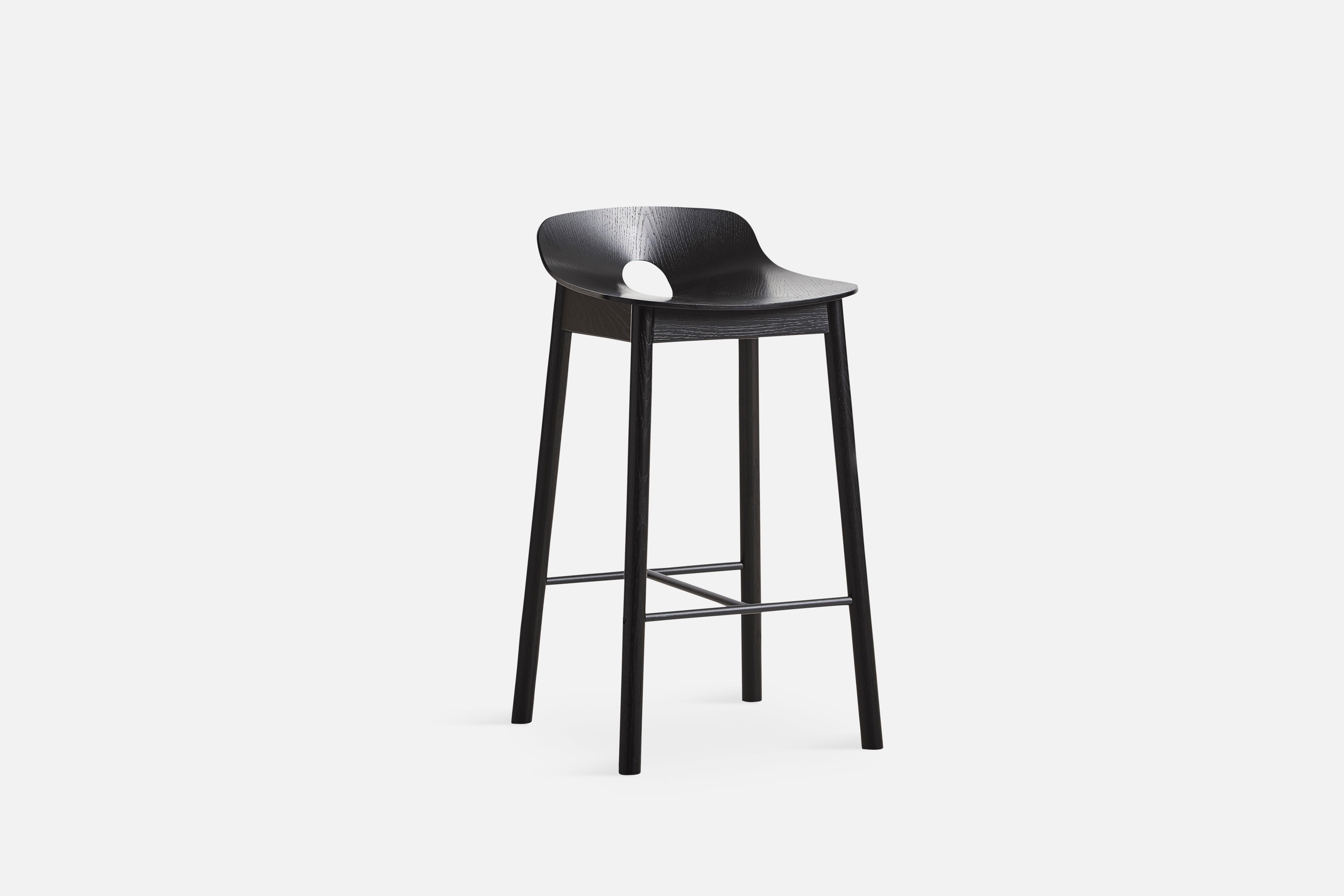 Black Ash Mono counter chair by Kasper Nyman
Materials: Plywood with oak veneer
Dimensions: D 42.8 x W 42.2 x H 77.6 cm

The founders, Mia and Torben Koed, decided to put their 30 years of experience into a new project. It was time for a change