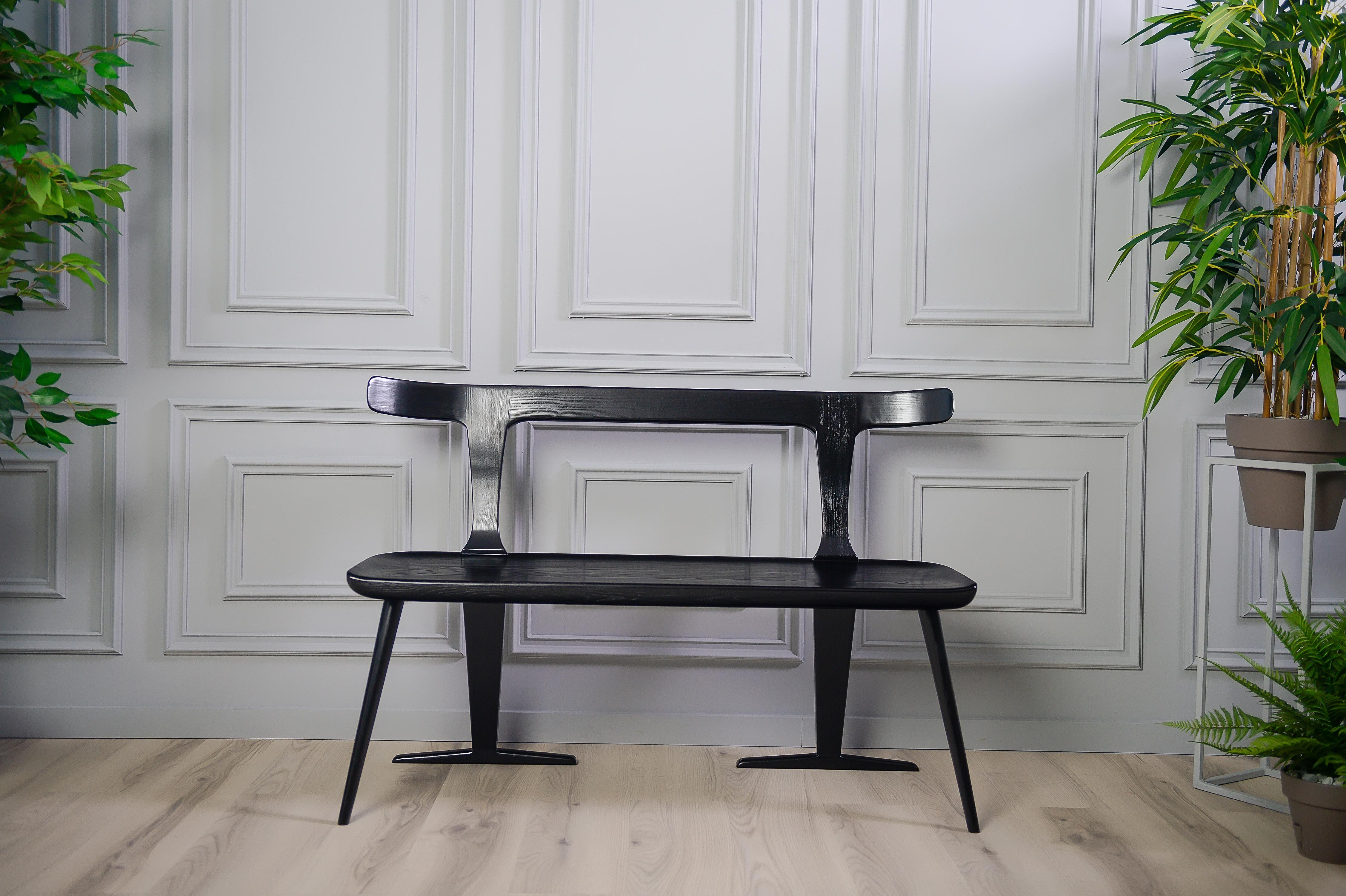The eola bench provides a multi-use bench that can be easily placed in the kitchen, dining room, den, lounge or other space. With a double backing and forward angled legs, this Mid-Century Modern piece offers a uniqueness that otherwise cannot be