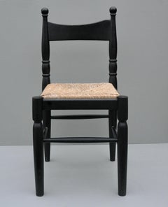 Sedia surrealista asimmetrica nera in legno e giunco, Francia, anni '60