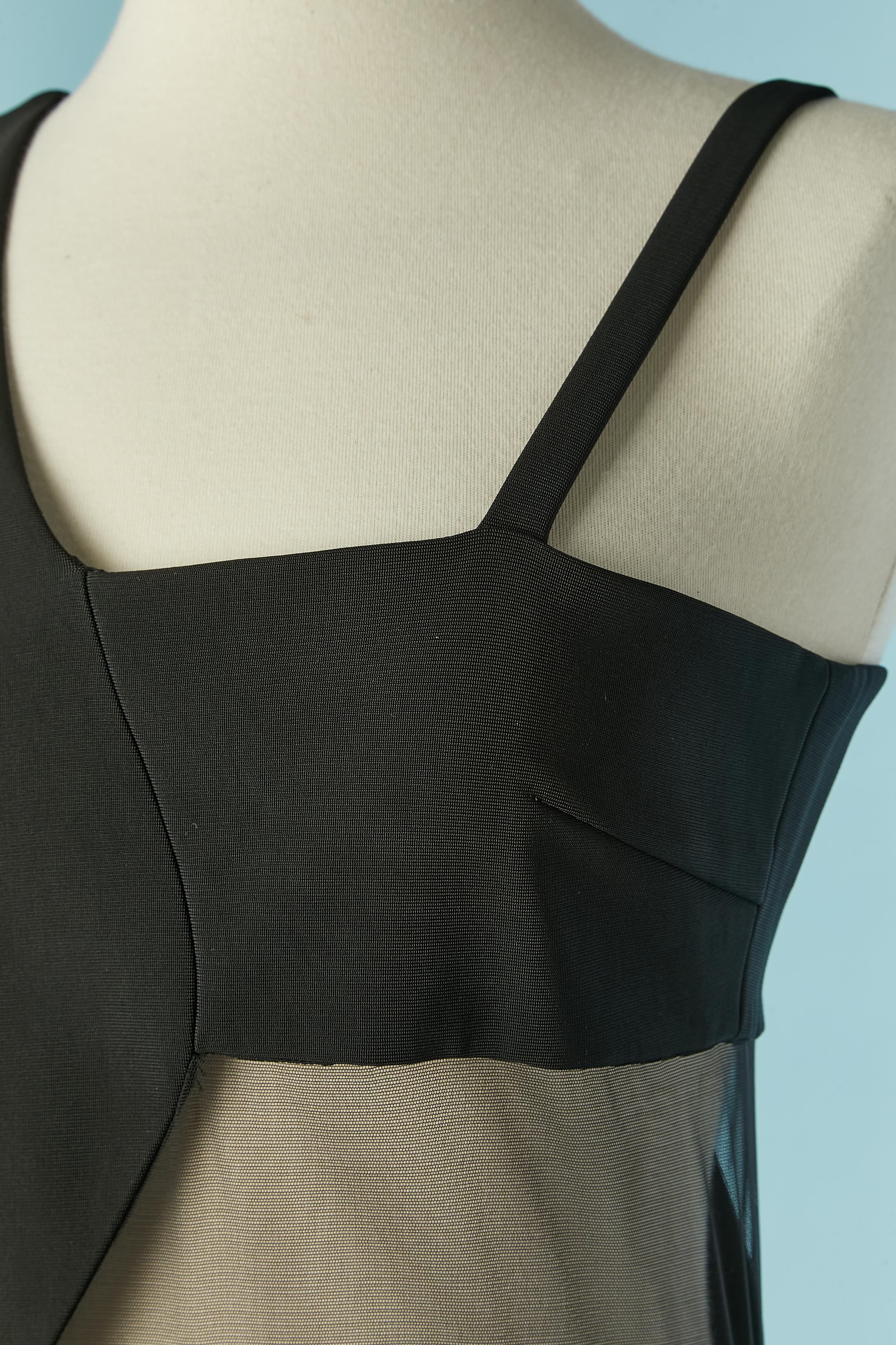 Black asymmetrical cocktail dress with cut-work. Main fabric composition: 86% rayon, 10% polyamide, 4% elastane. Nylon tulle. Lining: 57% rayon, 43% polyester. 
Zip and hook&eye closure on the middle back. 
SIZE 38 (Fr) M 
