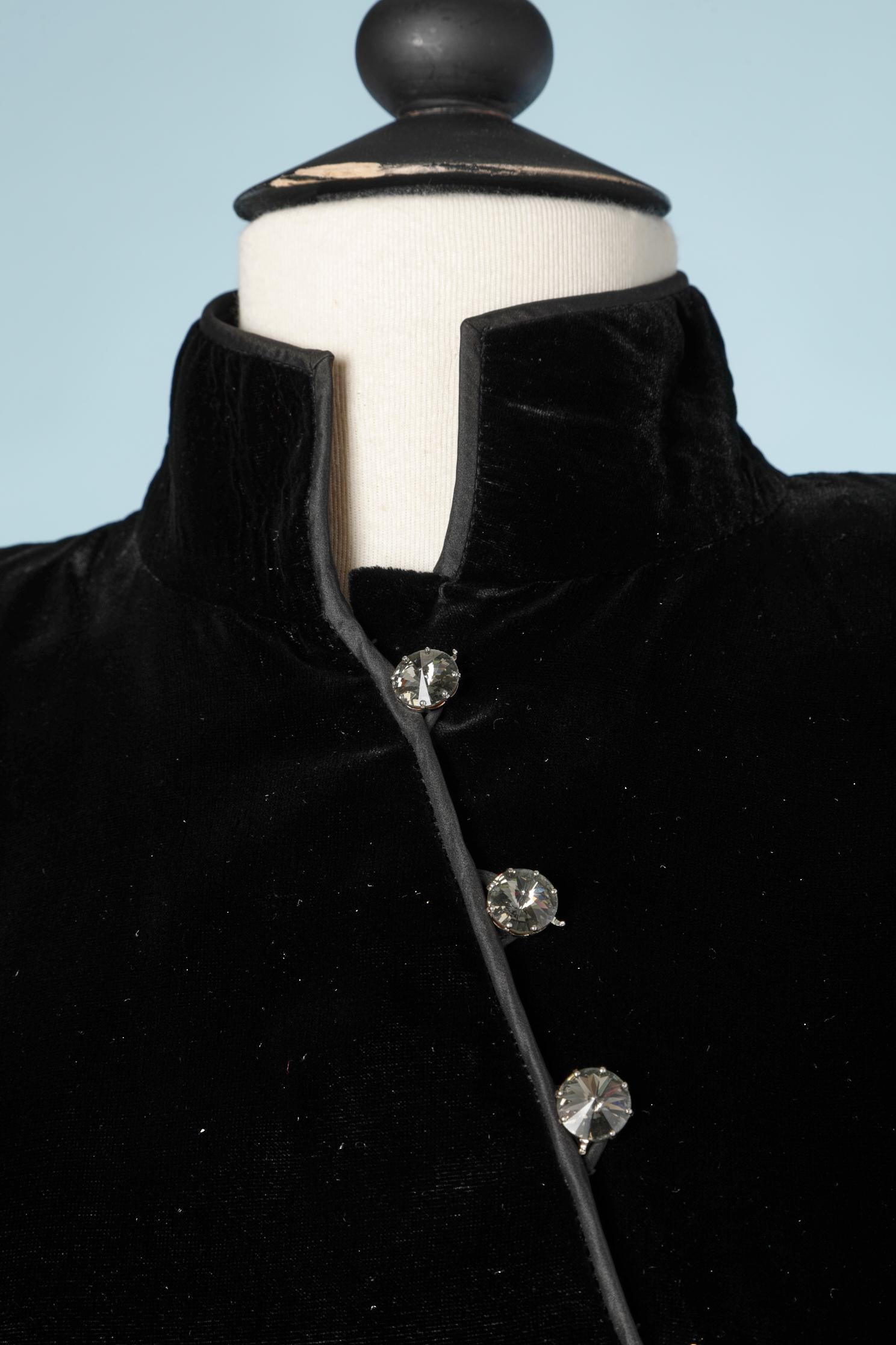 Black asymmetrical silk velvet cocktail dress with oversize taffetas sleeves and rhinestone buttons.
Probably Yves Saint Laurent Rive Gauche 1993