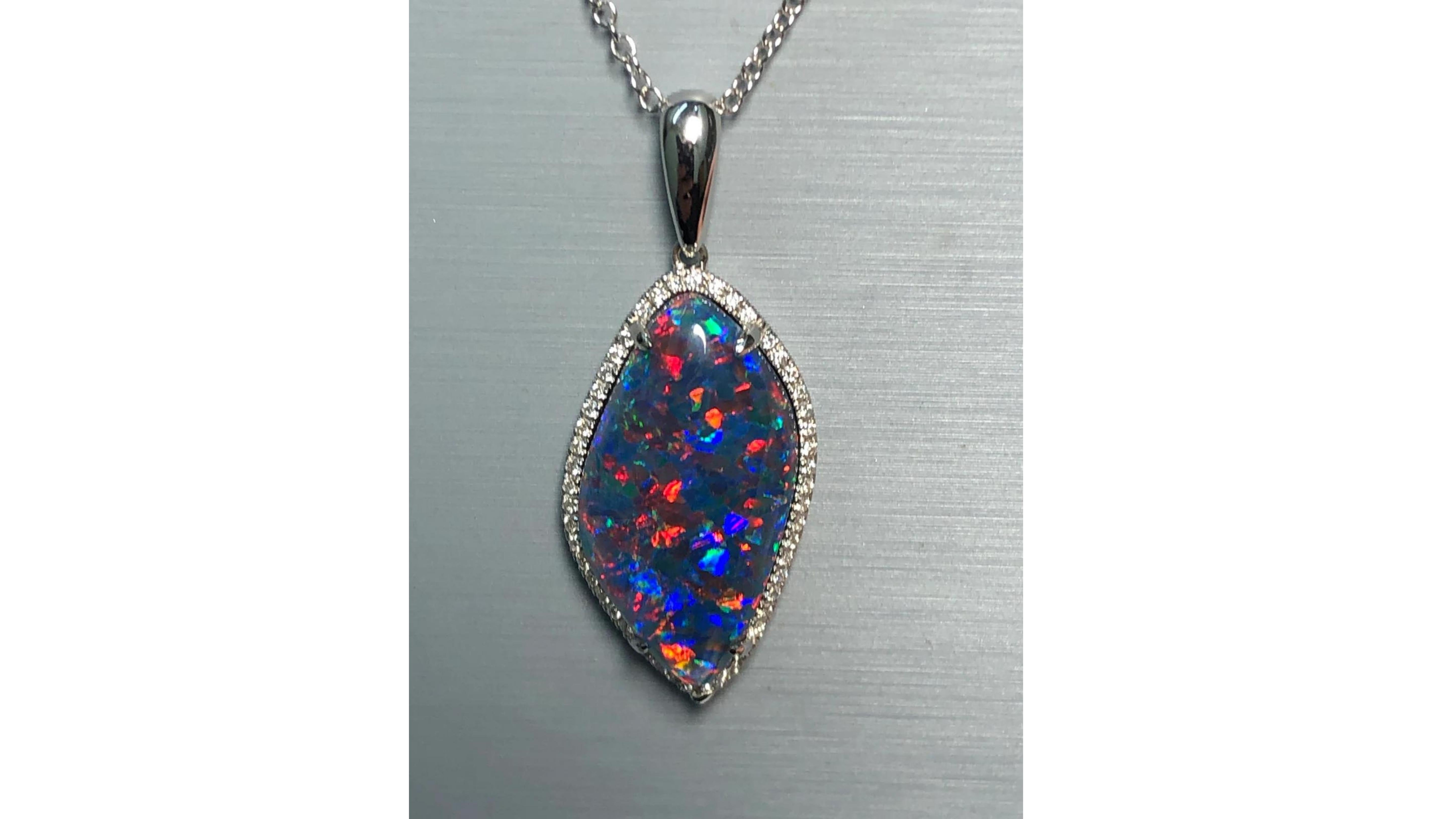 
Black Australian Opal Diamond Necklace   . This is with 48 White Diamonds set in 18 Karat White Gold and really does stand out.  The Opal Shows off very bright Colors Blue Green Yellow Orange Red which is a rare color to find.  This is as black