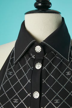 Black backless swimsuit with rhinestone plastron and button Chanel Resort 2023