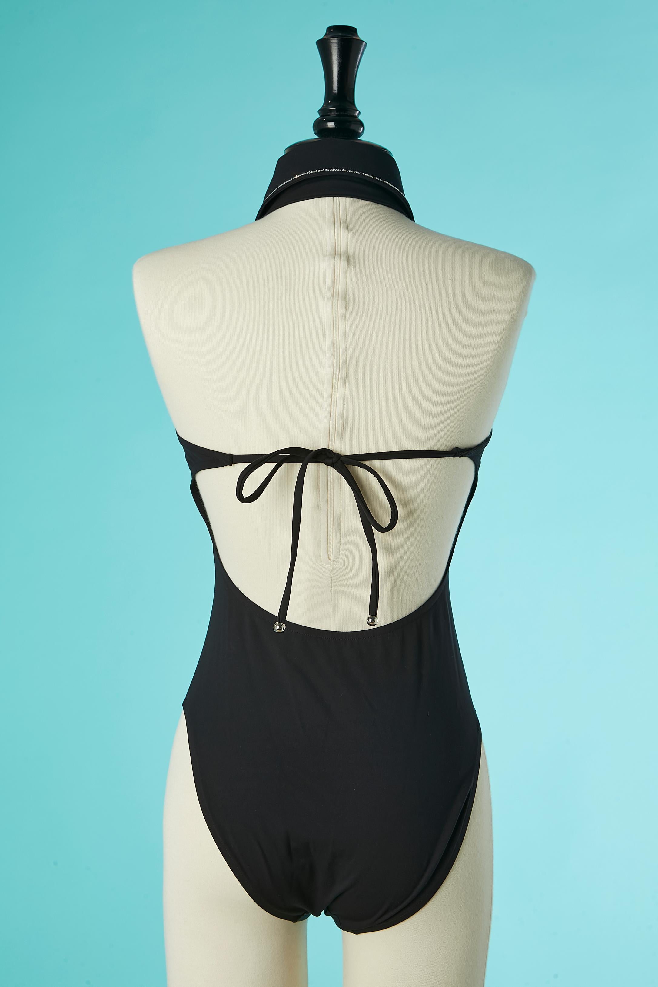 Black backless swimsuit with rhinestone plastron and button Chanel Resort 2023 1