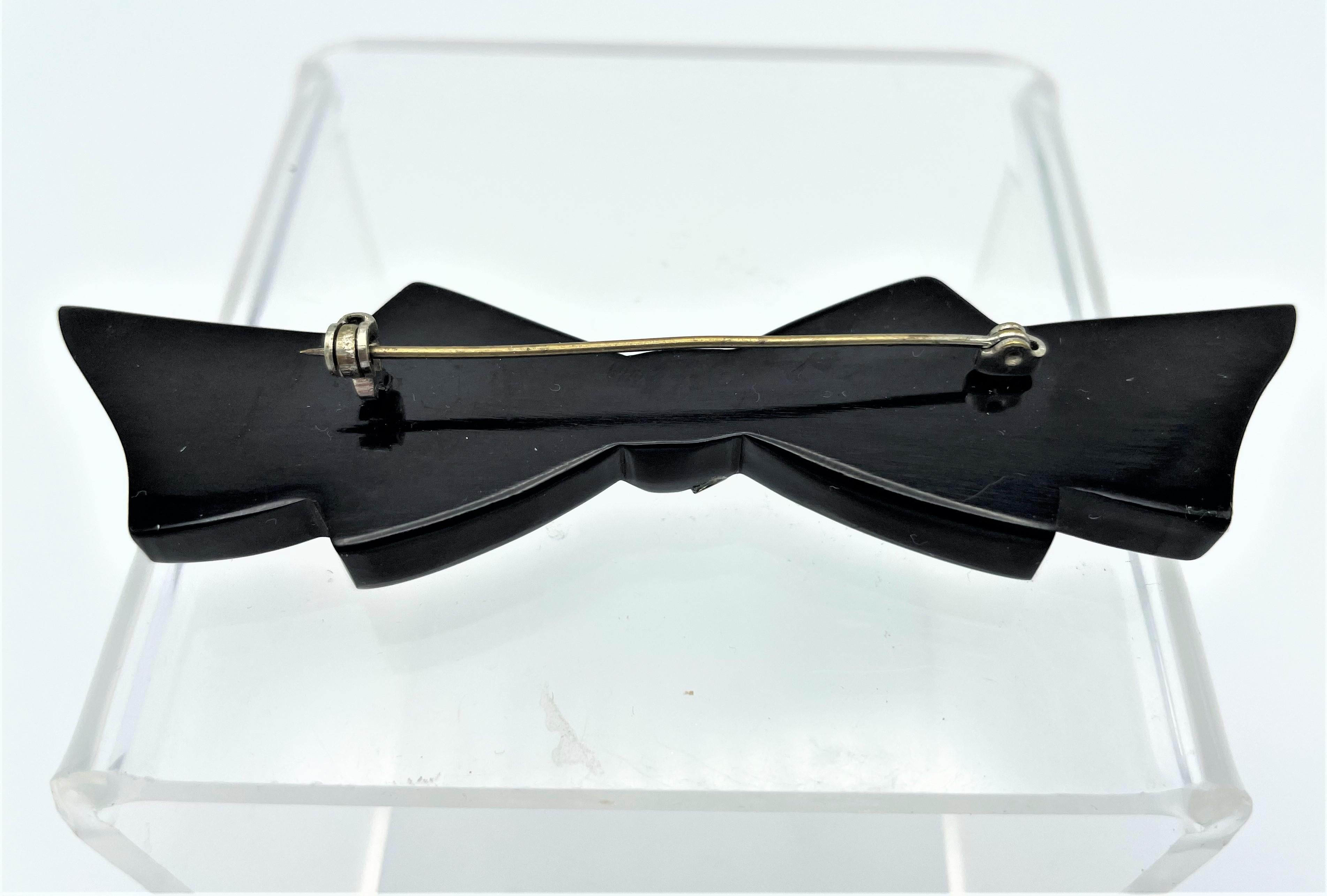 Artisan Black Bakelite bow brooch with  many rhinestones, 1950s USA For Sale