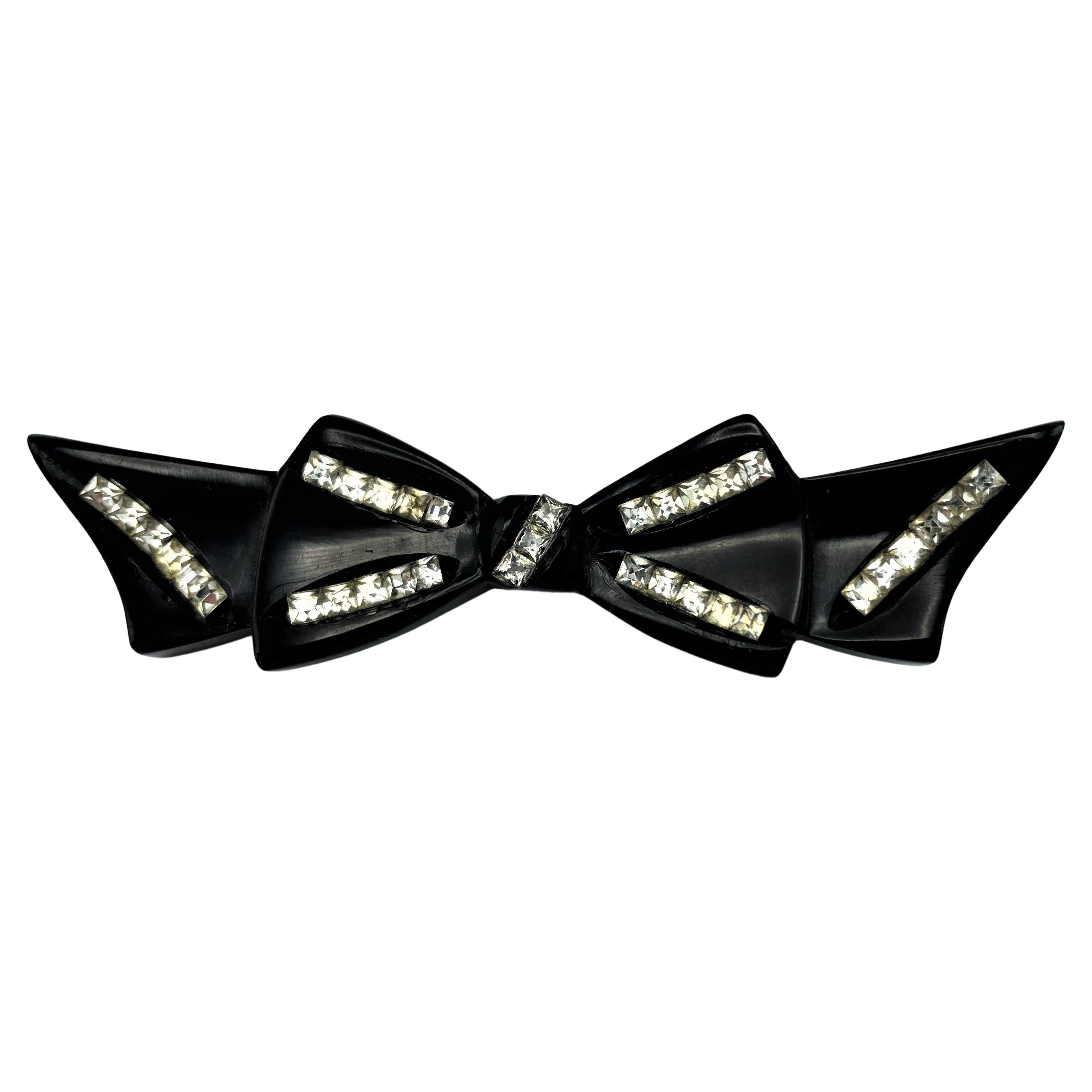 Black Bakelite bow brooch with  many rhinestones, 1950s USA For Sale