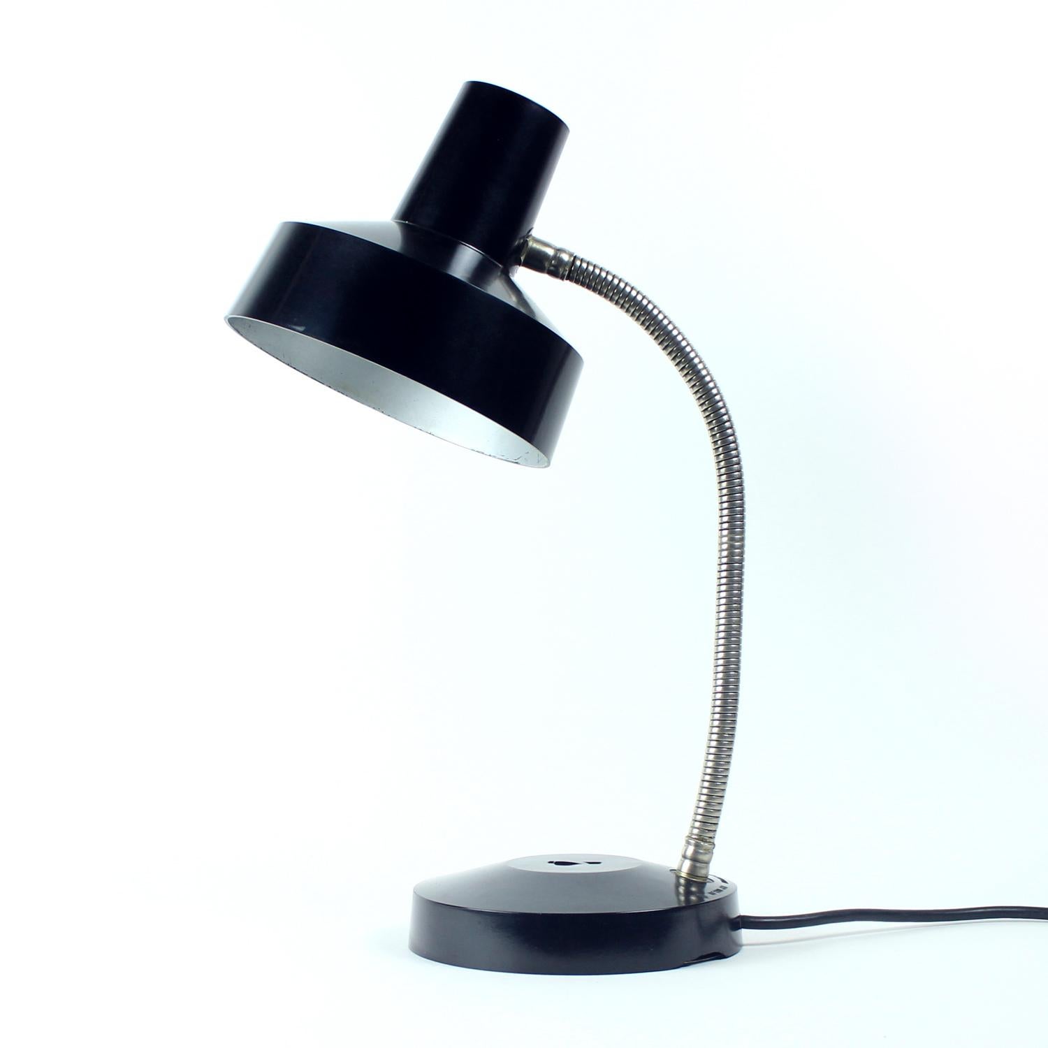 Great industrial table lamp. Produced in Czechoslovakia by Elektrosvit company as Type 1013.01 lamp. Originally the lamps were used at Police stations of the Communist Czechoslovakia. The lamp is made in black bakelite shield and base. The shield is