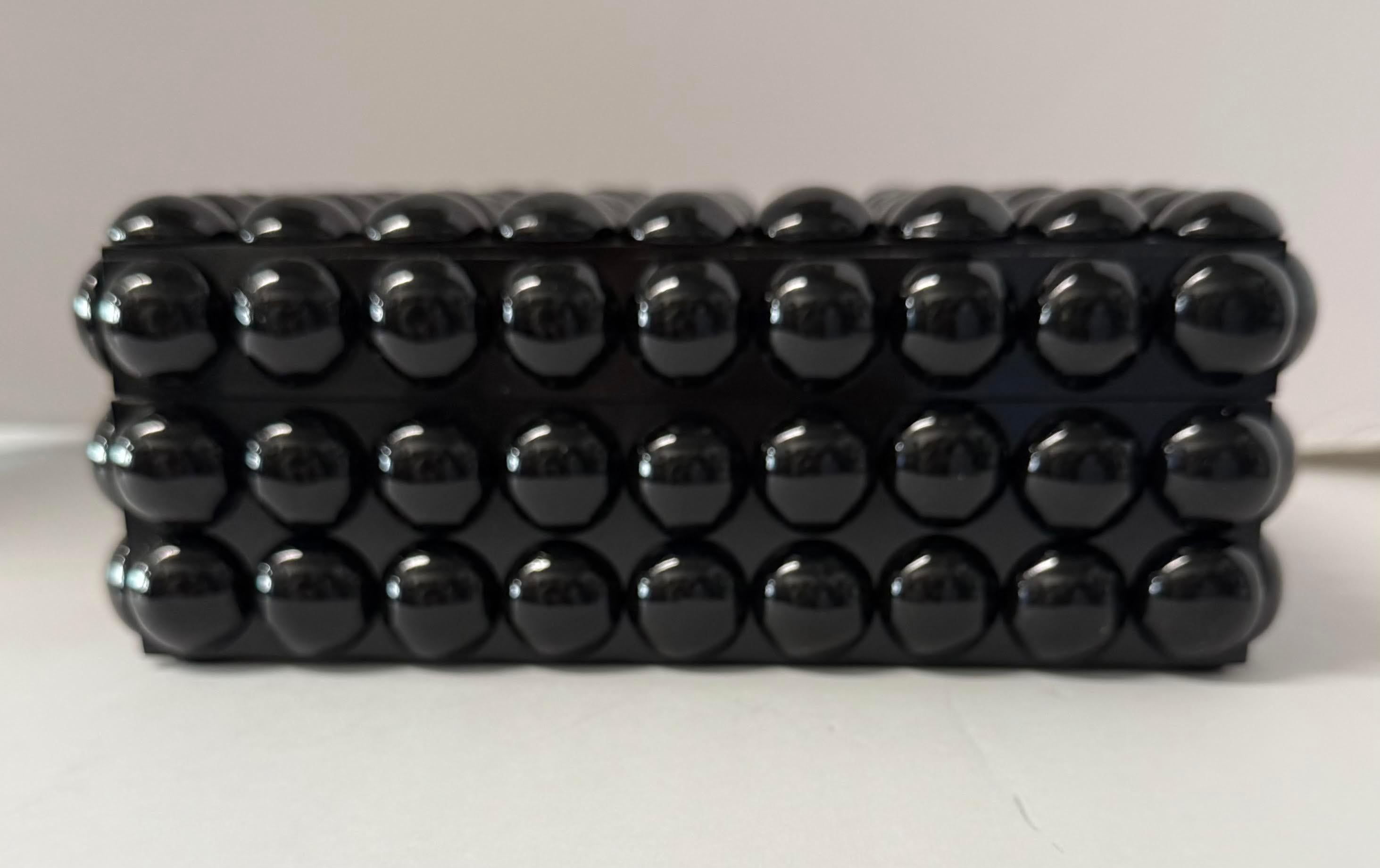 Contemporary Indian black allover ball shape design lidded resin box.
Part of a large collection.