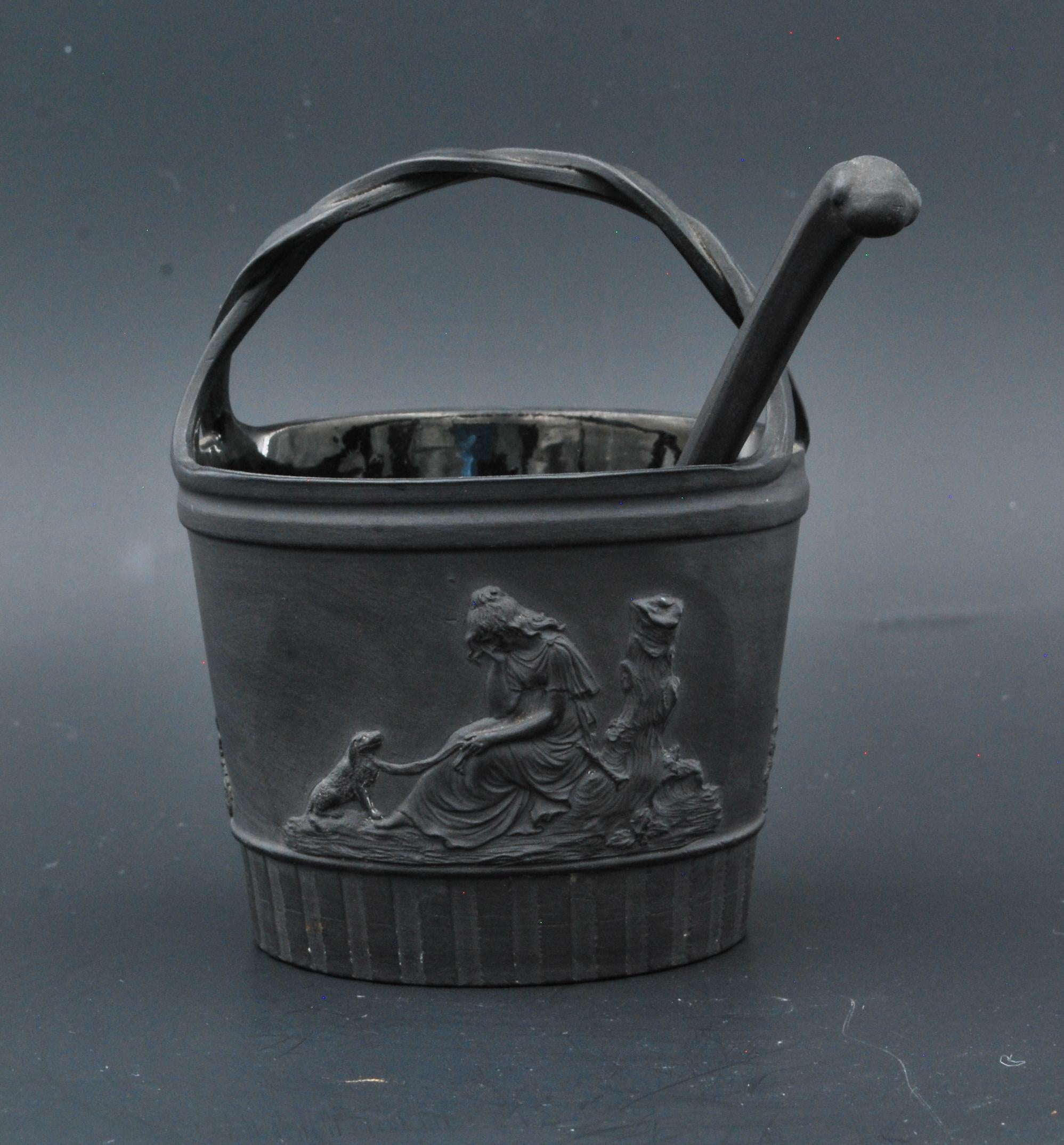 A delightful cream pail in black basalt, decorated with Poor Maria and Charlotte at the Tomb of Werther. The associated makes it very special indeed.