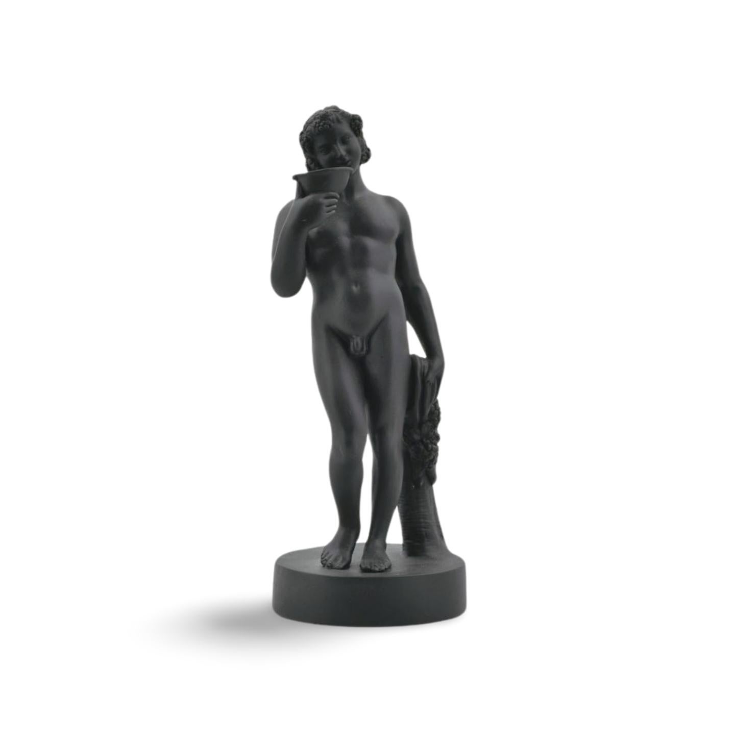 Exceptionally rare early figure of Bacchus in black basalt. The mixed-case mark places this figure between 1780 and 1785.

He is portrayed in typical style, his head garlanded with grapes and with a wine cup to his lips.


Bacchus, also known as