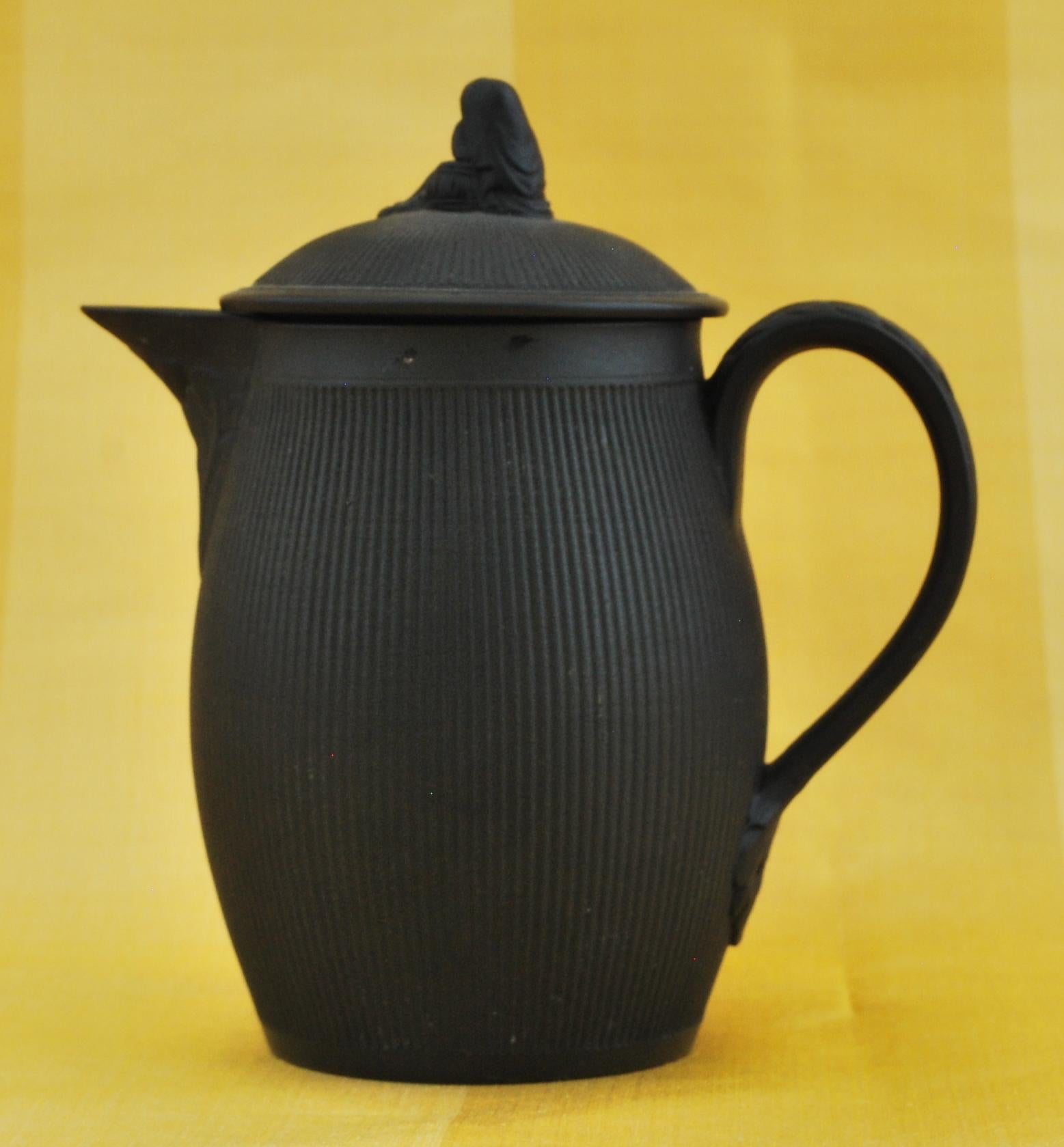 Baluster-shaped jug, with sparrow-beak spout and cover, for hot milk or hot water. The engine-turned decoration is particularly fine.

Marked.