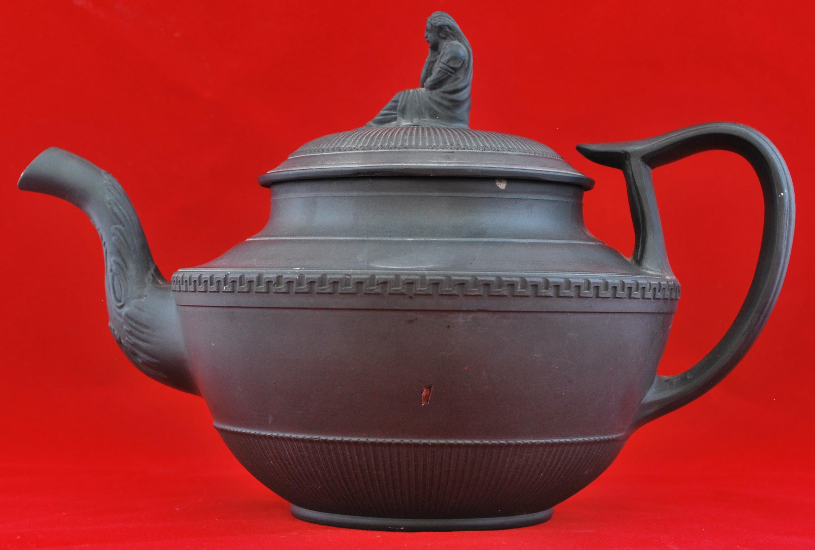 A fine teapot with D-shape handle and a peculiar finial in the form of a widow without her barrel & cruze. 

The finial confirms the Turner attribution.