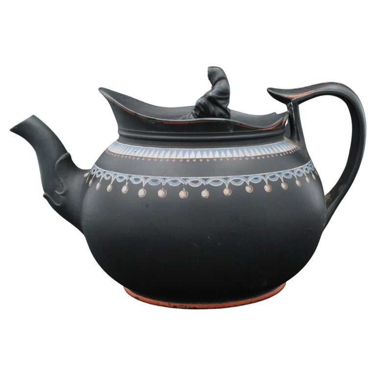https://a.1stdibscdn.com/black-basalt-teapot-with-enamel-decoration-probably-spode-c1800-for-sale/f_31513/f_259580121635910862926/f_25958012_1635910863905_bg_processed.jpg?width=768