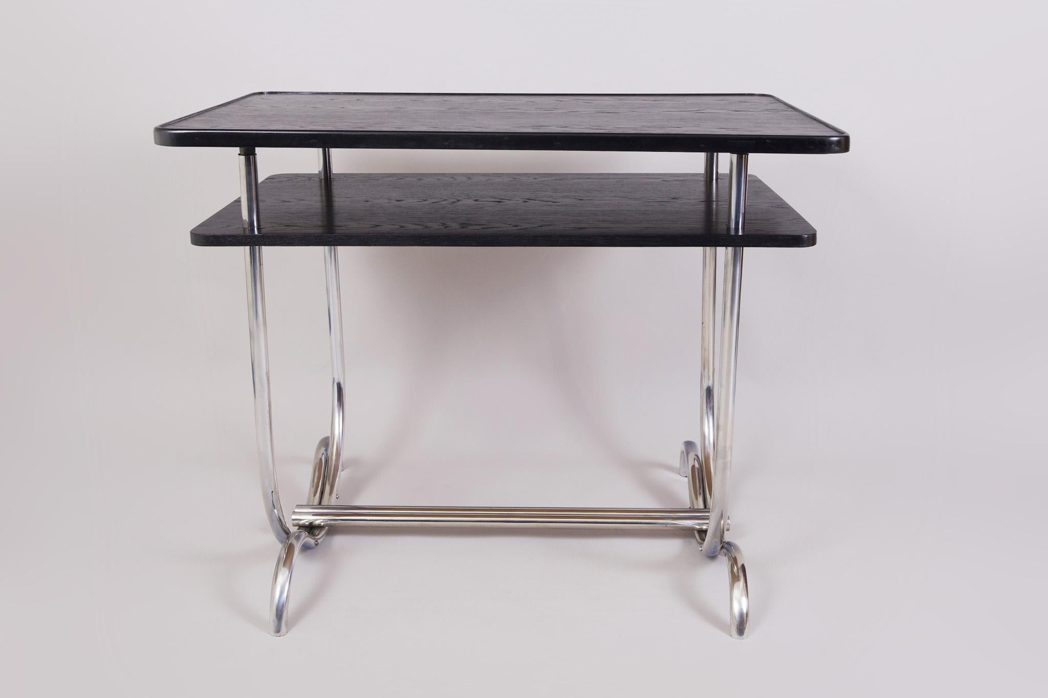 Made in Germany in the 1930s and restored by our team. 
The wood used for the top is Oak.
Chromed Steel frame.
