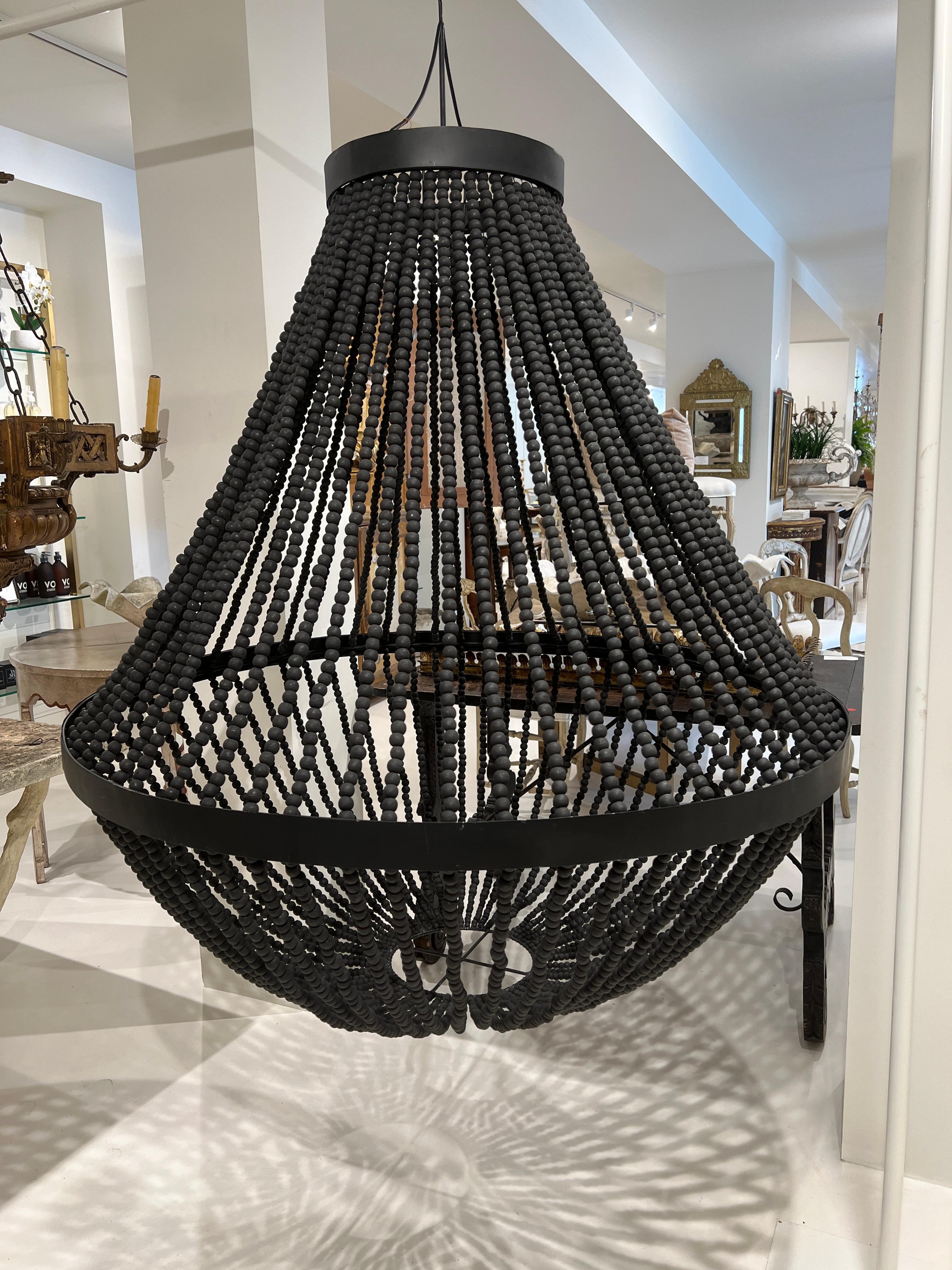 When size matters, this magnificent chandelier will wow. Completely matte black and designed with the upmost simplicity. This is a shade only. A lighting element would need to be added.