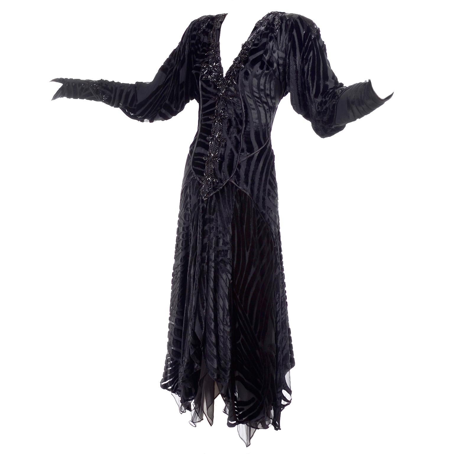 This is an absolutely gorgeous vintage black midi length black dress that came from the estate of a woman who owned incredible designer clothing. Her stunning wardrobe included rare designer pieces, avant garde clothing,  and sensational mid to late