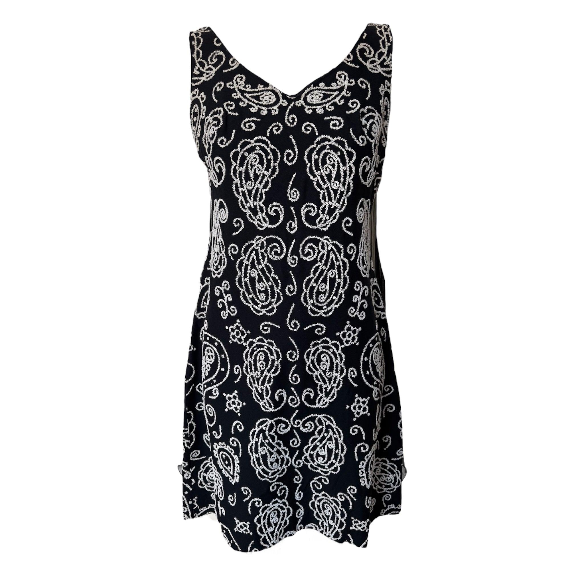 Schwarzes perlenbesetztes Minikleid mit plissiertem Flattereinsatz im Rücken, 1960er Jahre