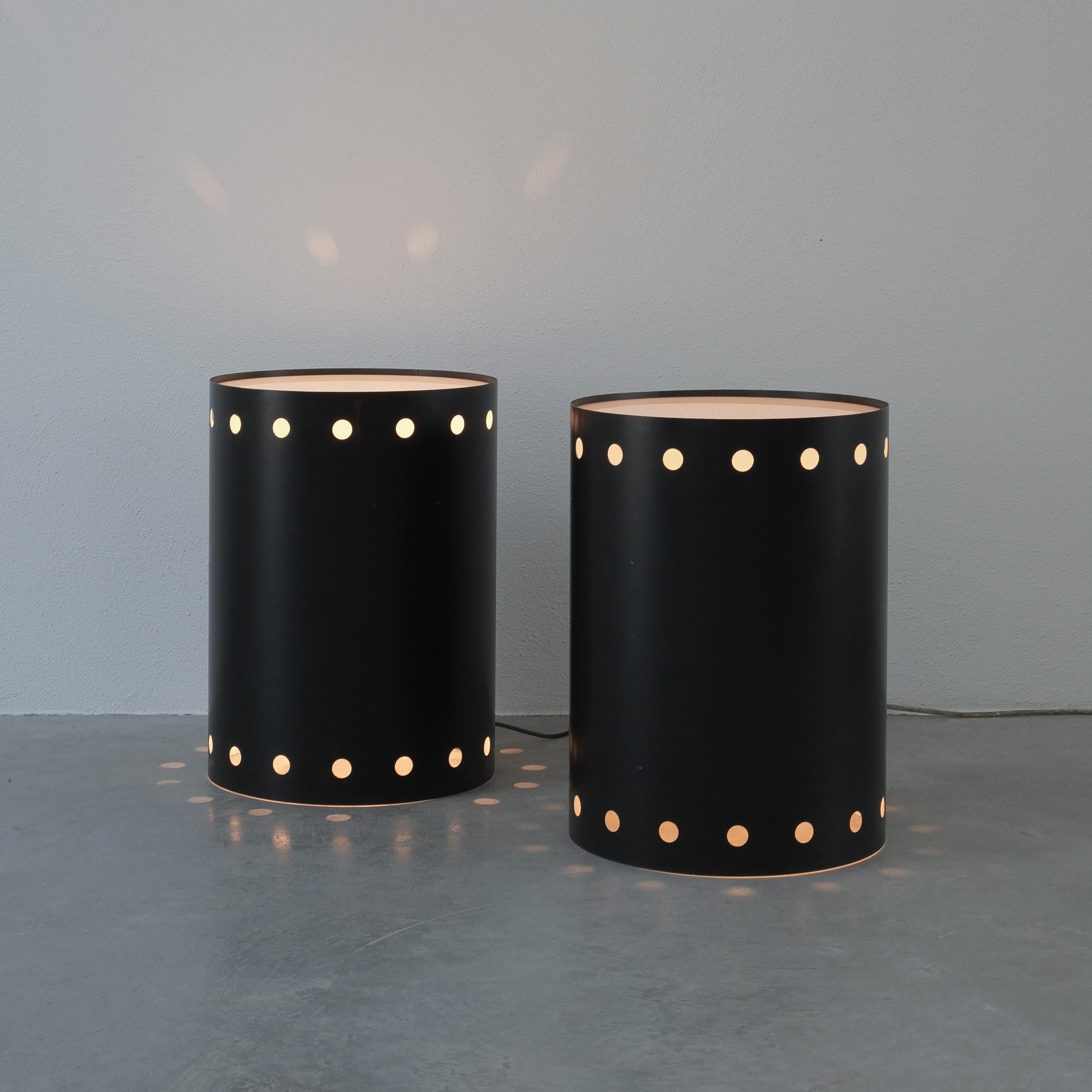 Black bed side tables with lights, Germany circa 1965- sold as a pair

Very rare tubular blackened steel side tables that work with dimmable lamps. Stunning 1960 design made from steel sheet and Lucite. Both work with a large e26/27 bulb up to