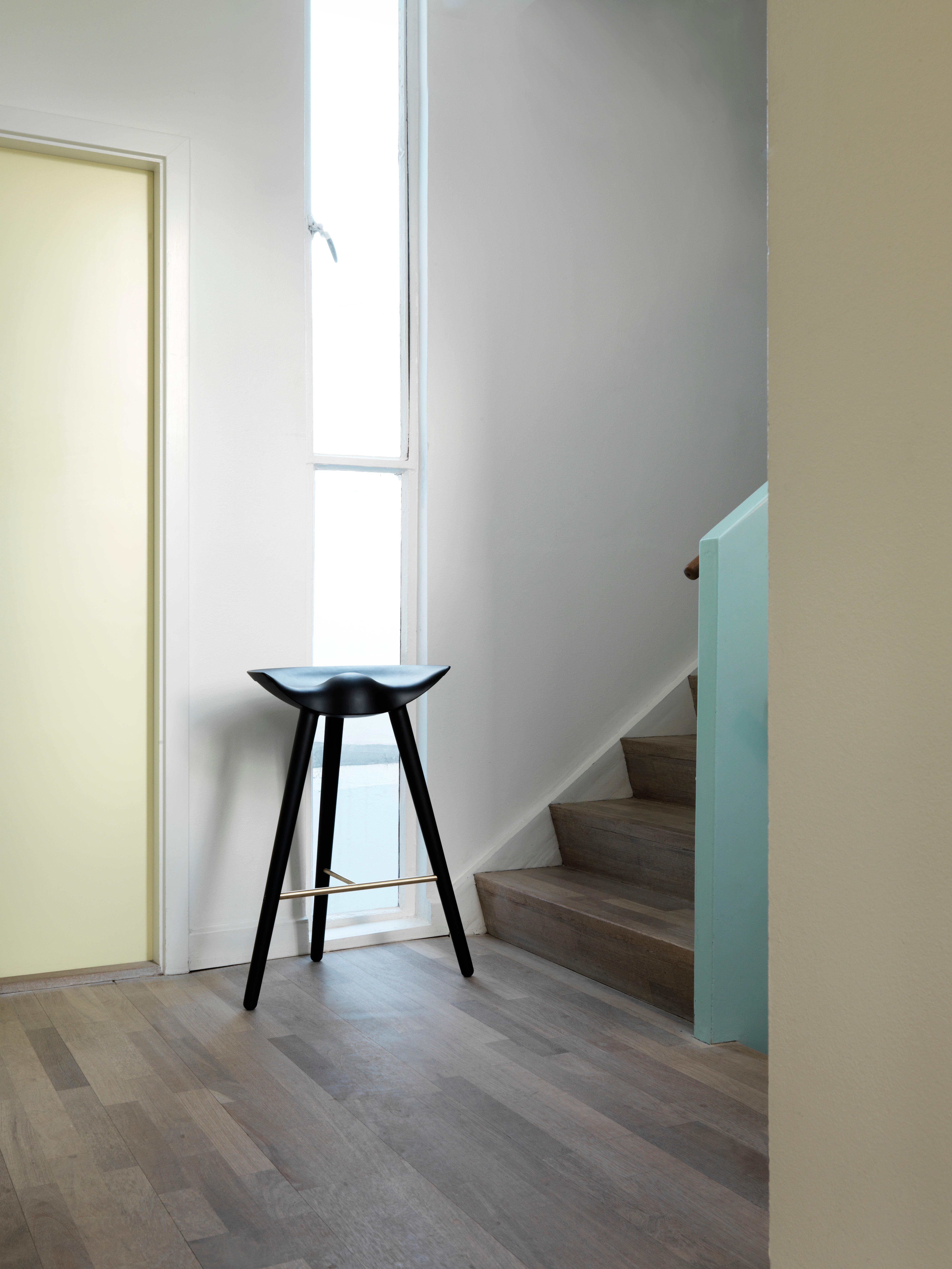 ML 42 Black Beech and Brass Bar Stool by Lassen.
Dimensions: H 77 x W 36 x L 55.5 cm.
Materials: Beech, brass.

In 1942 Mogens Lassen designed the Stool ML42 as a piece for a furniture exhibition held at the Danish Museum of Decorative Art. He took