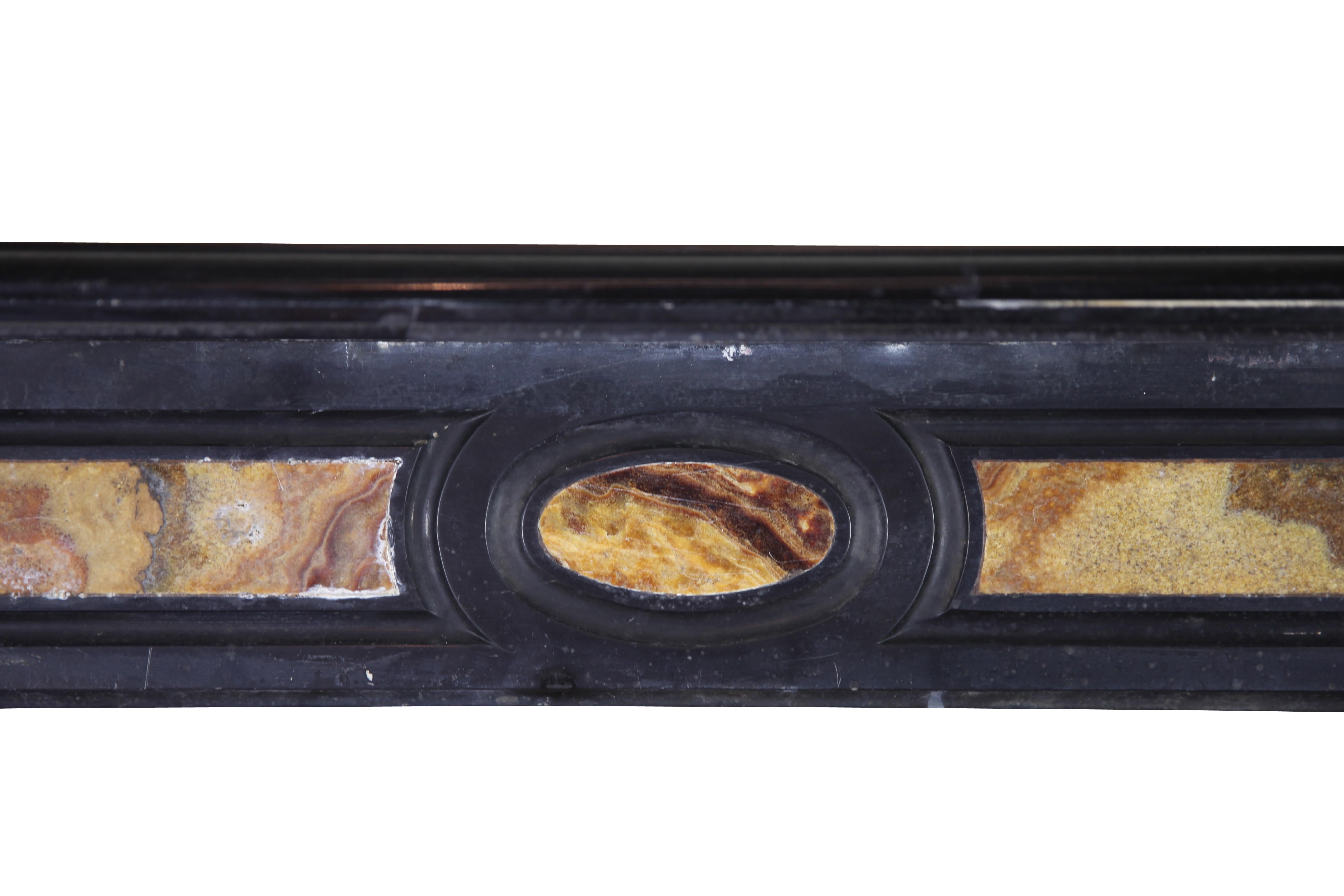 A Noir de Mazy en Onyx marble combination vintage fireplace surround from the Louis Phillipe period, 19th century.
Measures:
130 cm exterior width 51.18 inch
105 cm exterior height 41.34 inch
89 cm interior width 35.03 inch
87 cm interior
