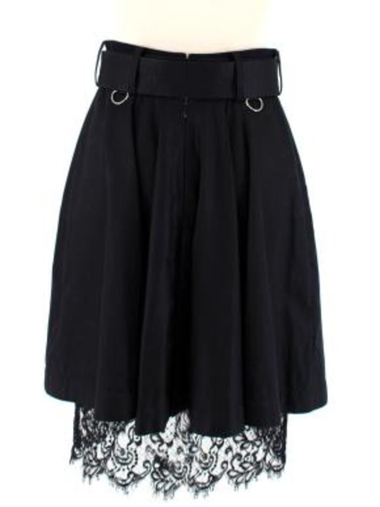 Sacai Black Belted Cargo Skirt with Wool & Lace Panels 
 

 - A-line belted cotton skirt with wool front panel and lace bottom trim
 - Silver D-rings on the belt 
 - Pleated at the back 
 - 2 functioning front flap pockets
 - Felted wool front