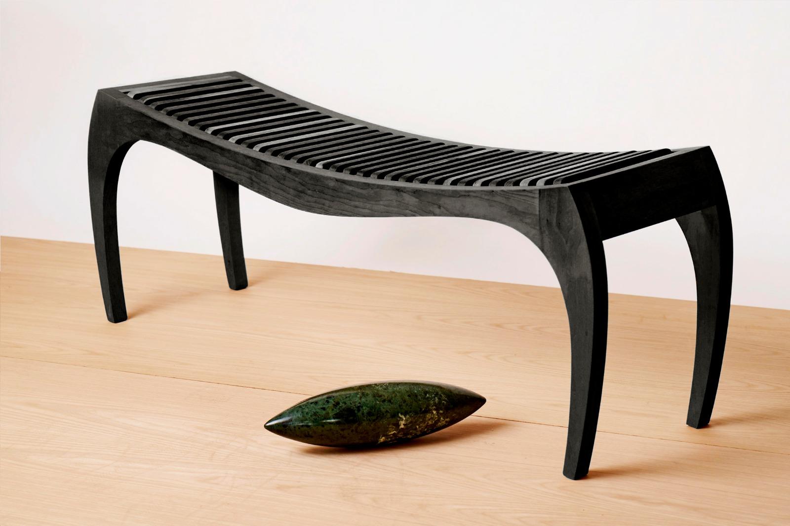 Black bench rumbo by Jean-Baptiste Van den Heede
Unique piece signed and numbered
Dimensions: L 118 x H 42 x W 31 cm 
Materials: solid wood

Jean-Baptiste Van den Heede defines himself as a cabinetmaker-designer and an artist of academic