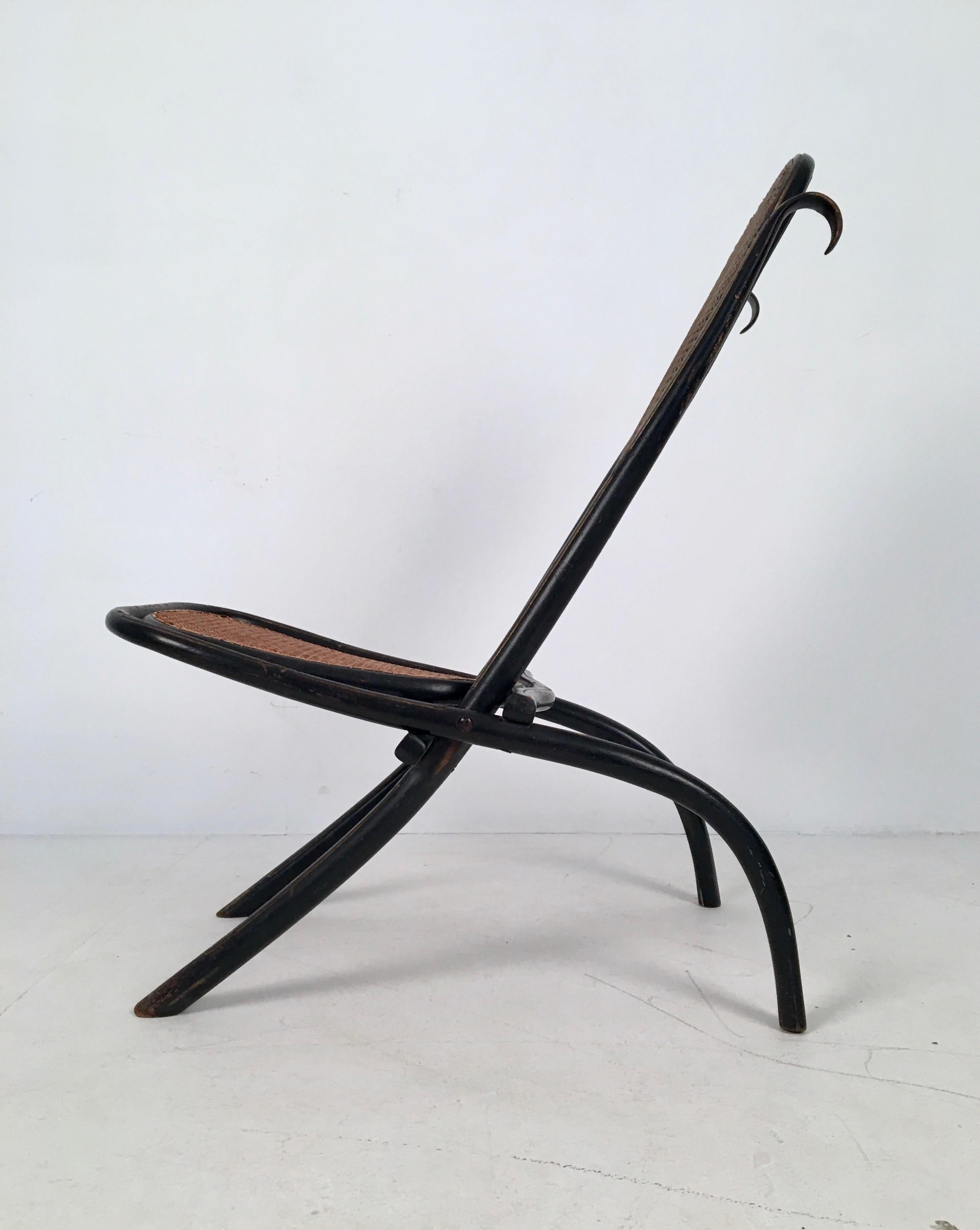 Rare folding bentwood and cane chair from the aesthetic movement, designed by Michael Thonet for Thonet, Austria, circa 1863 and manufactured in the early 20th Century.