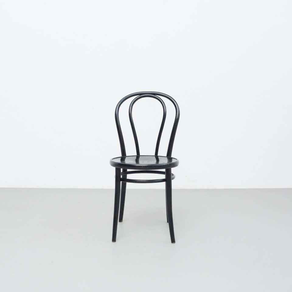 Black bentwood chair designed in the style of Thonet.  Made in France, circa 1950.    In original condition with minor wear consistent with age and use, preserving a beautiful patina.    Materials:  Wood    Dimensions:  D 47.5 x W 40,5 cm x H 83,5